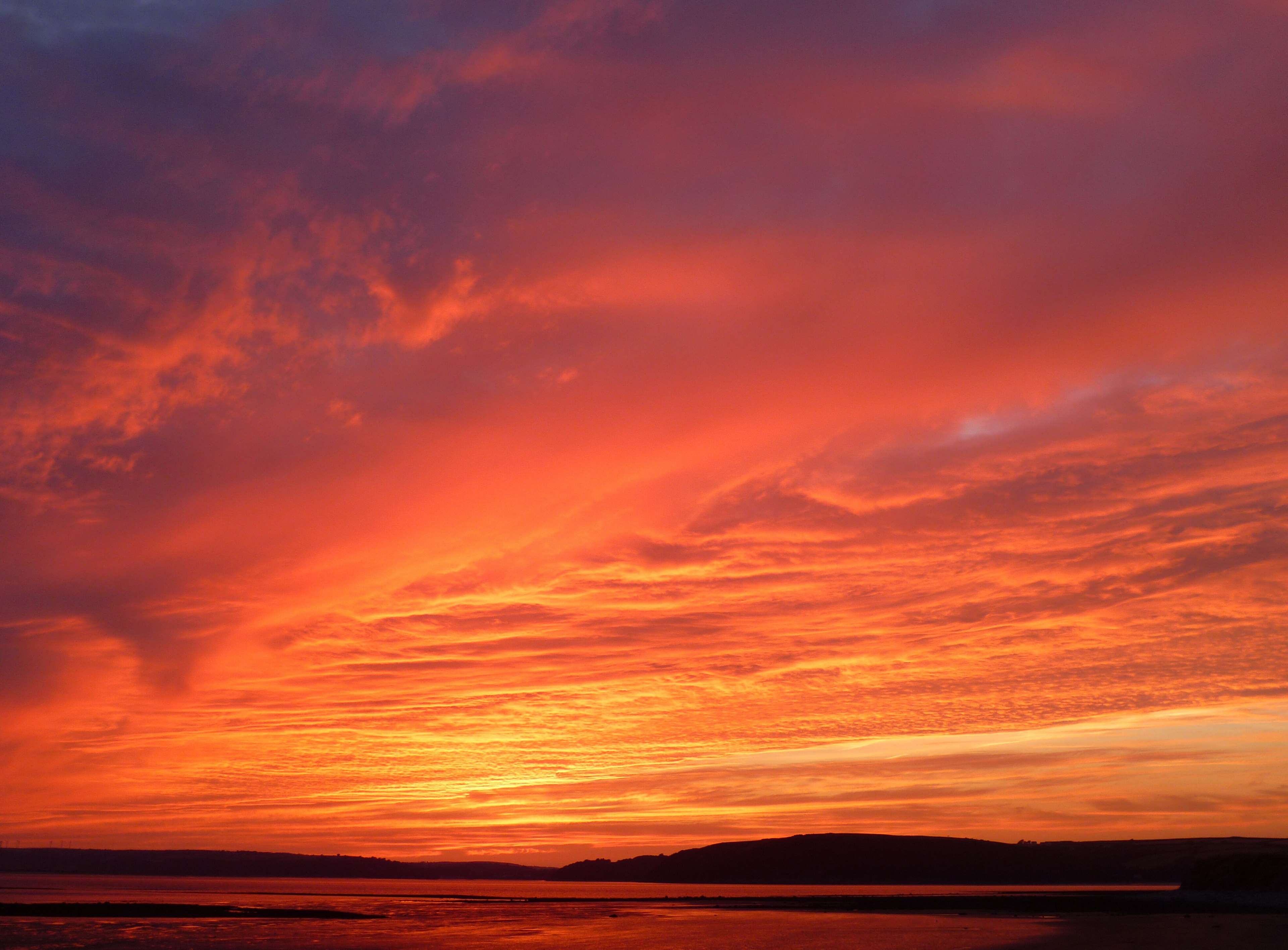 Dramatic sunset over water in Wales 4K HD Wallpaper