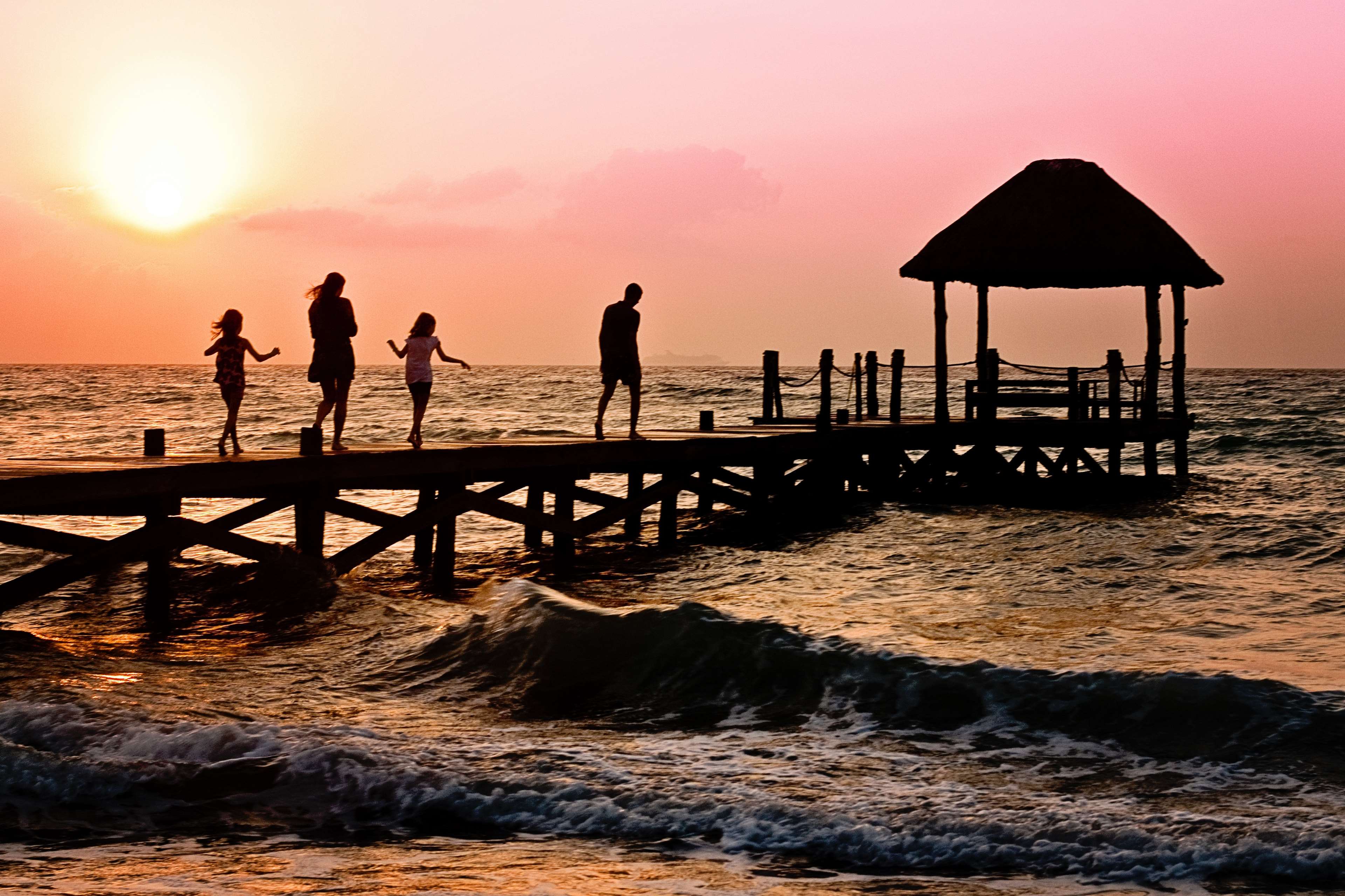 Family on a pier at sunset HD Wallpaper