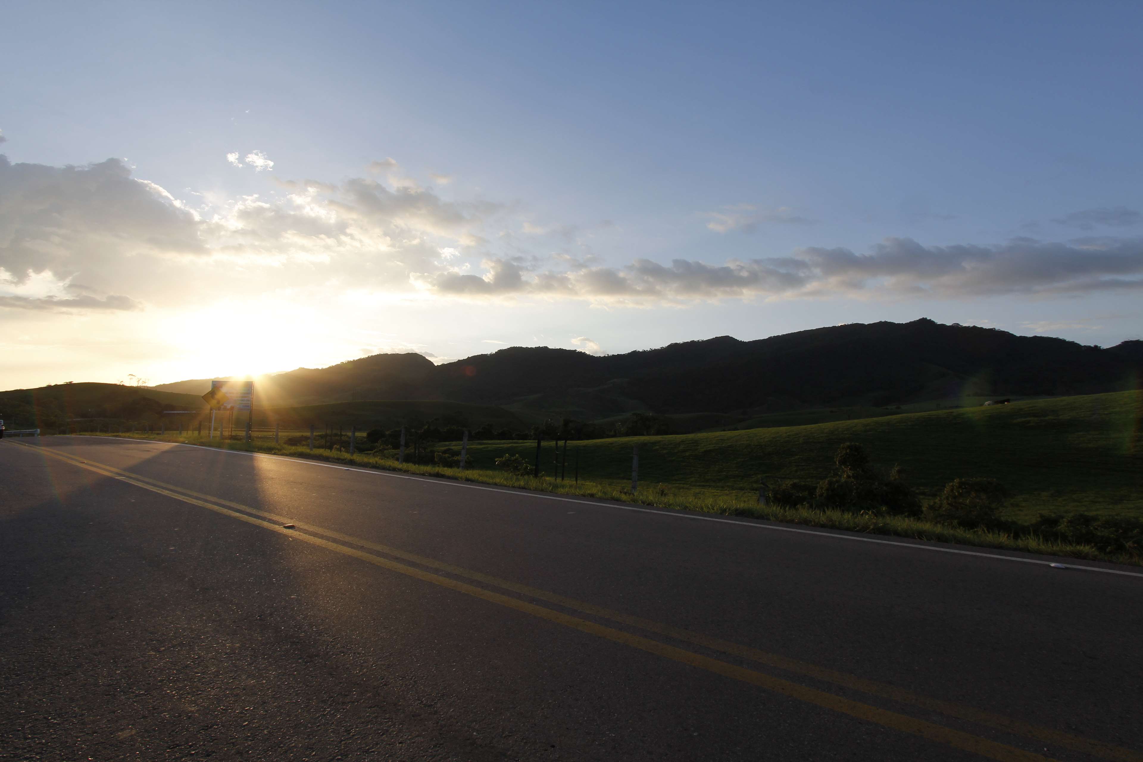 Road in Colombia at sunset with mountains and sky 4K HD Wallpaper