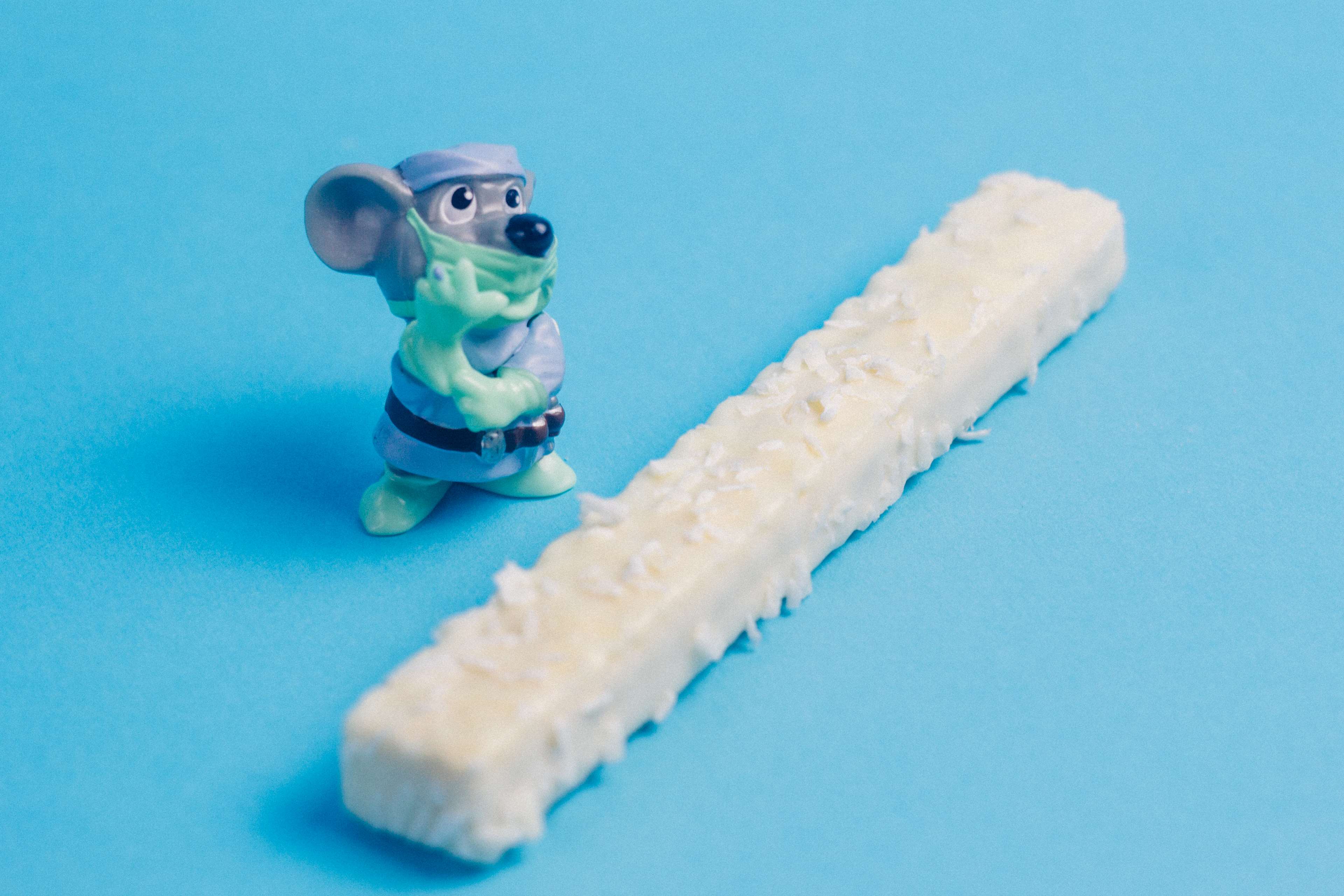Mouse toy wearing mask with churro HD Wallpaper
