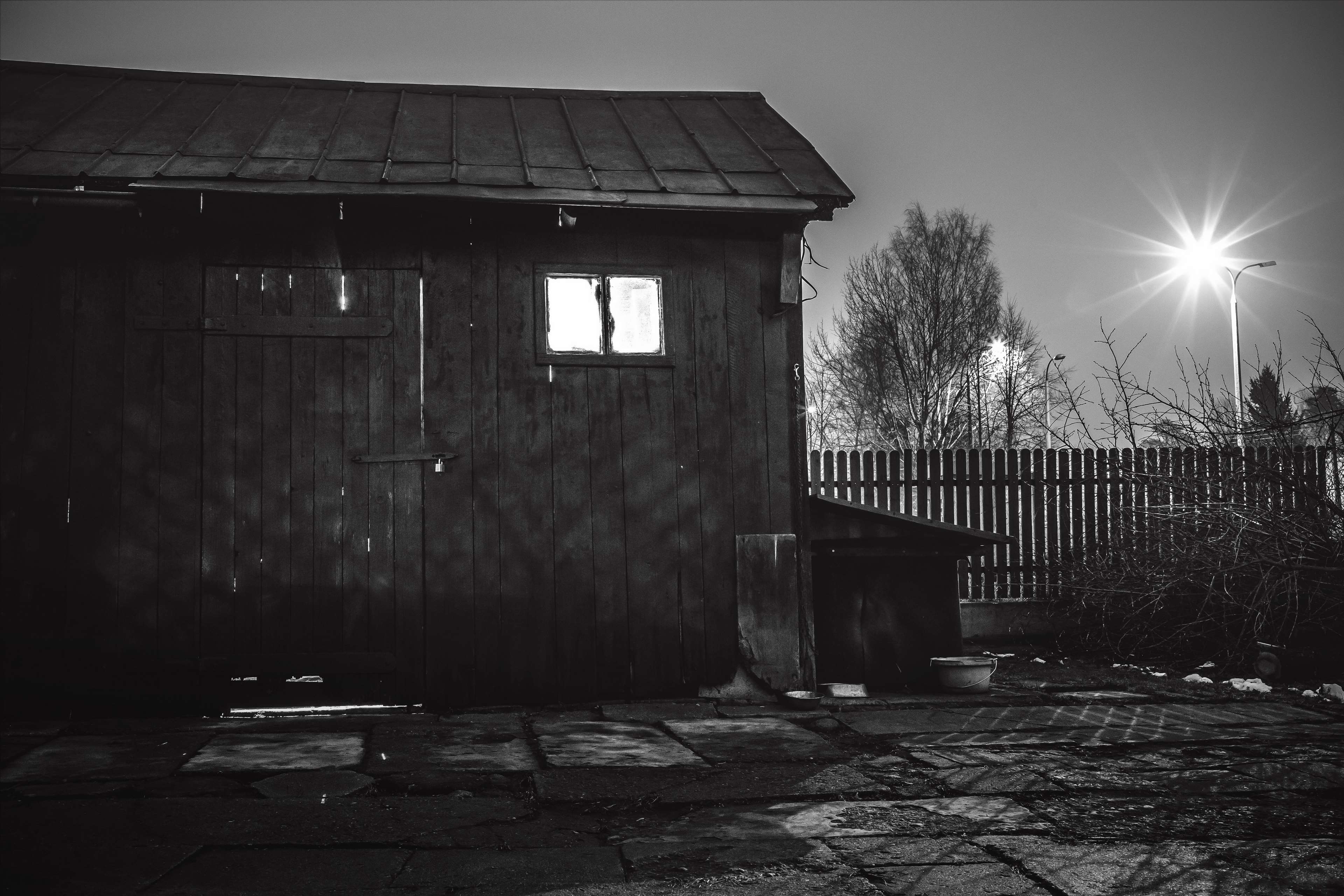 Dark wooden workshop with light in window at night 4K HD Wallpaper