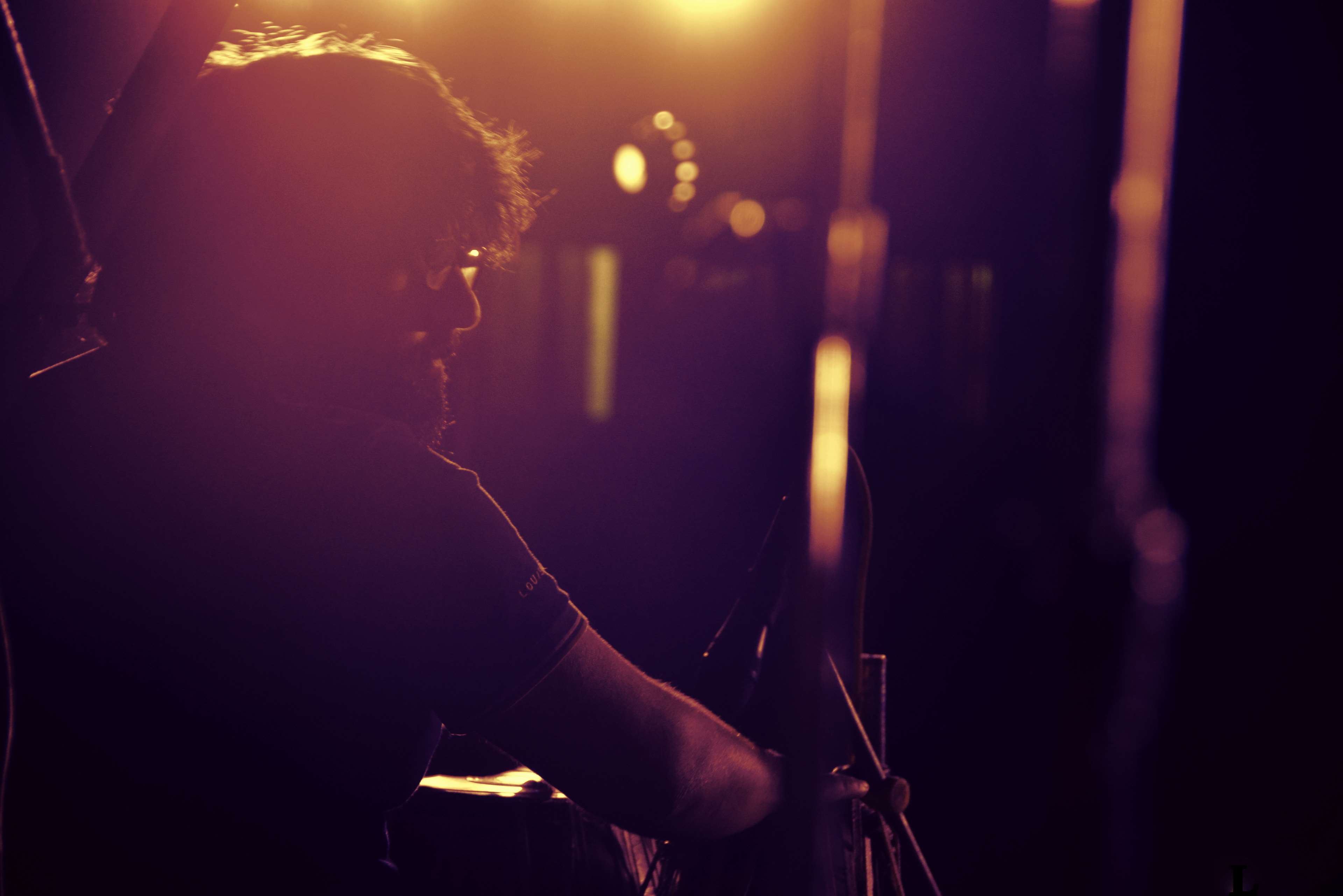 Musician performing on stage at night HD Wallpaper