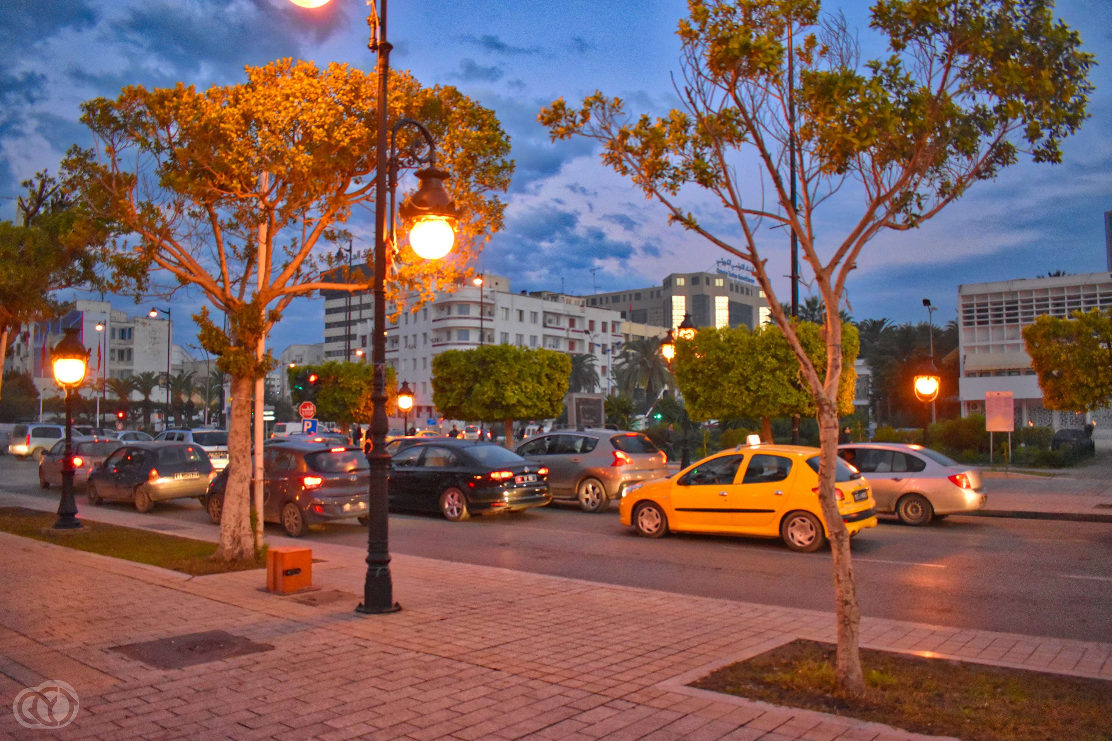 Street scene in Tunisia with taxi HD Wallpaper