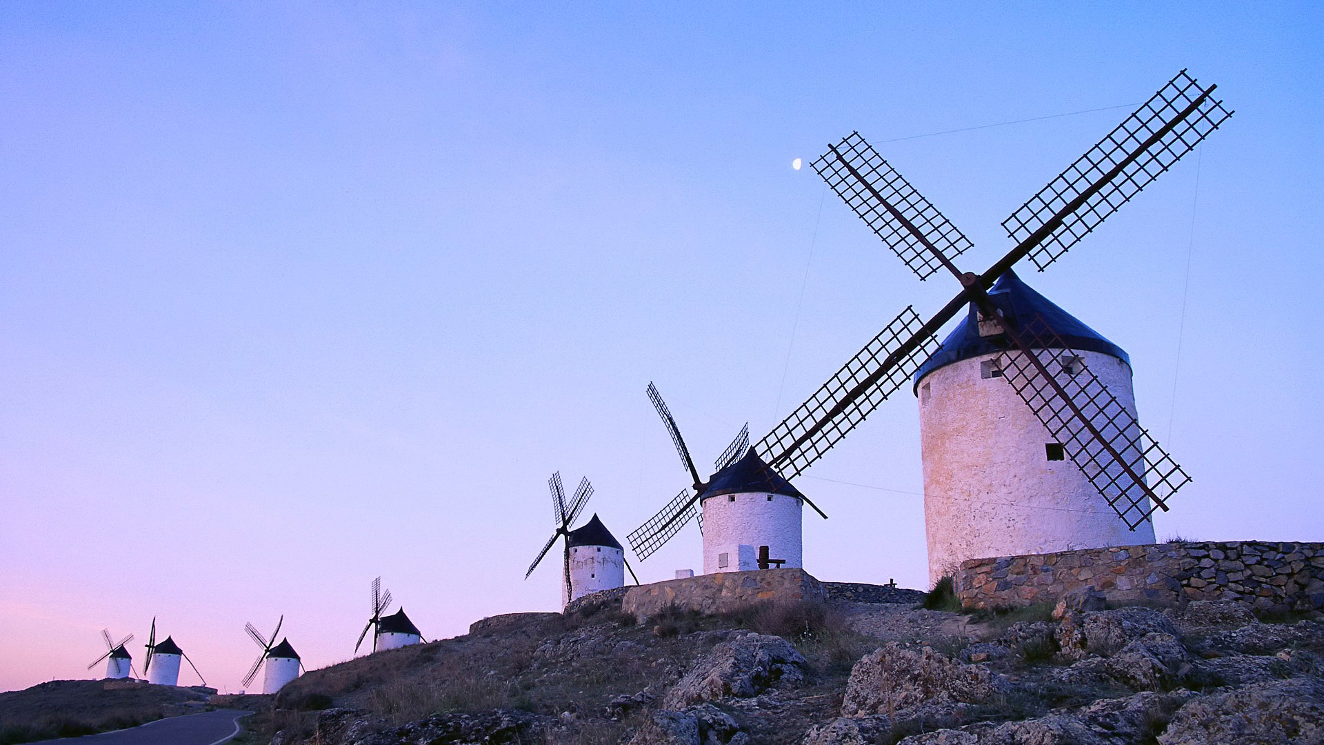 Windmills on a hill at dusk with moon HD Wallpaper