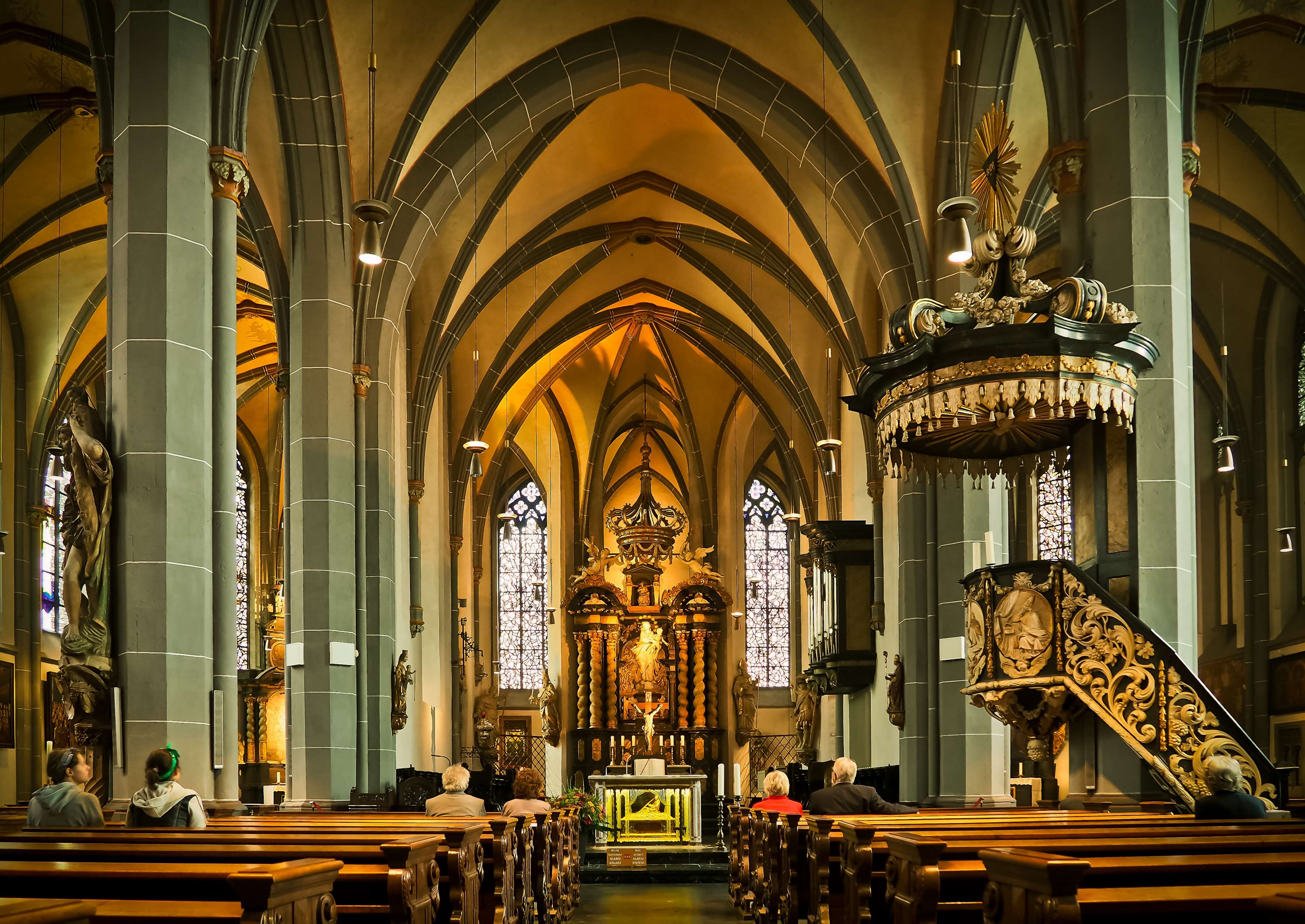 Interior view of a church with pews and altar HD Wallpaper