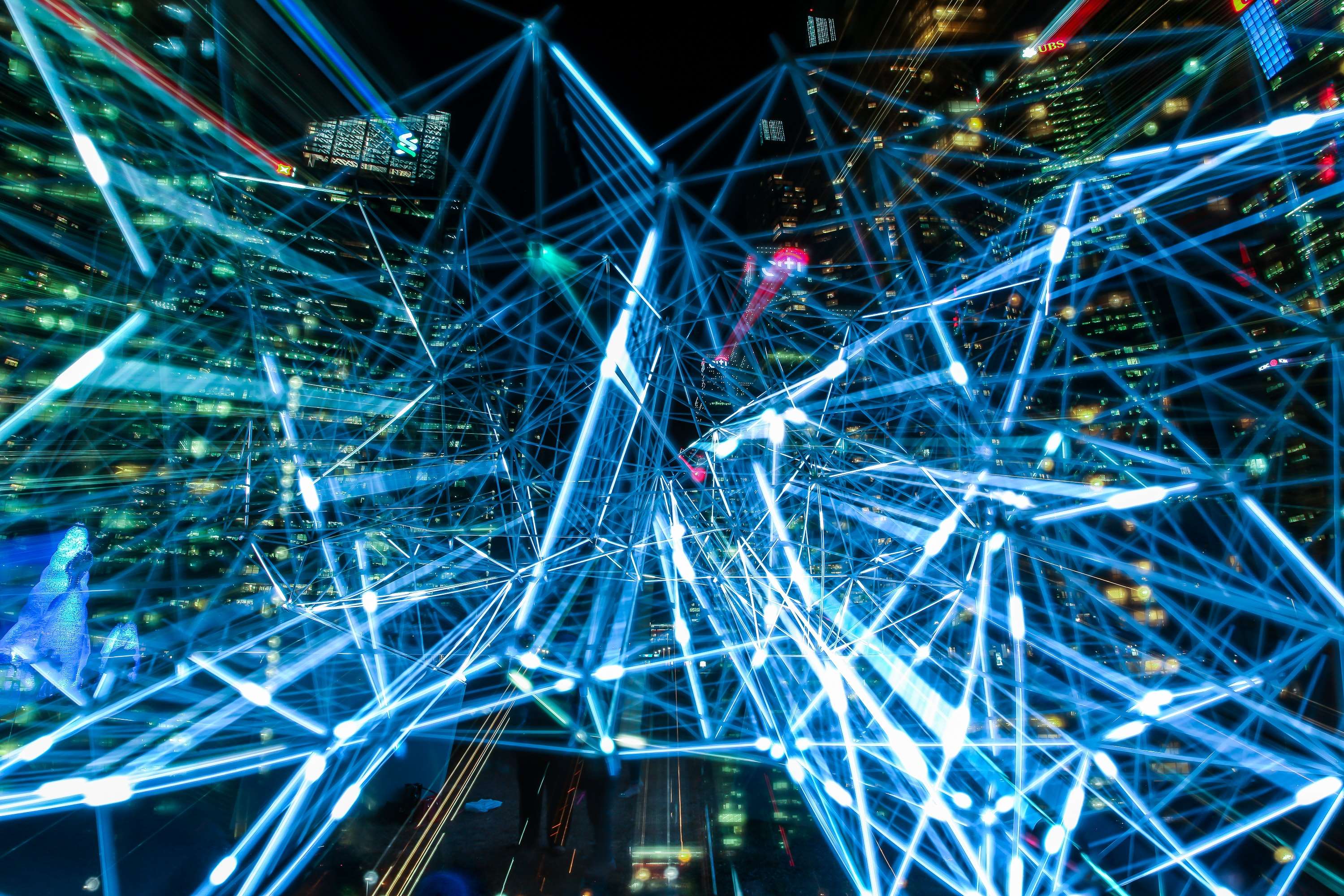 Abstract network of blue lights over a city at night HD Wallpaper