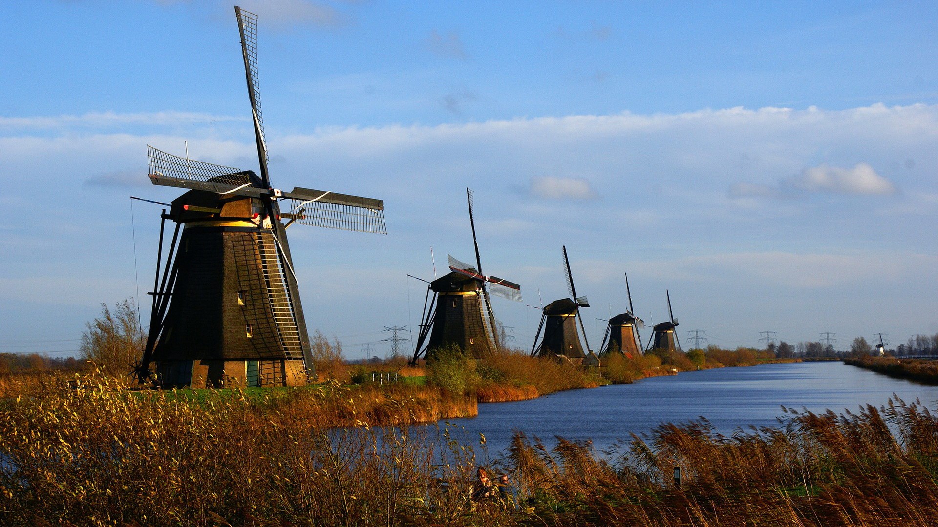 Windmills along a canal in the Netherlands HD Wallpaper