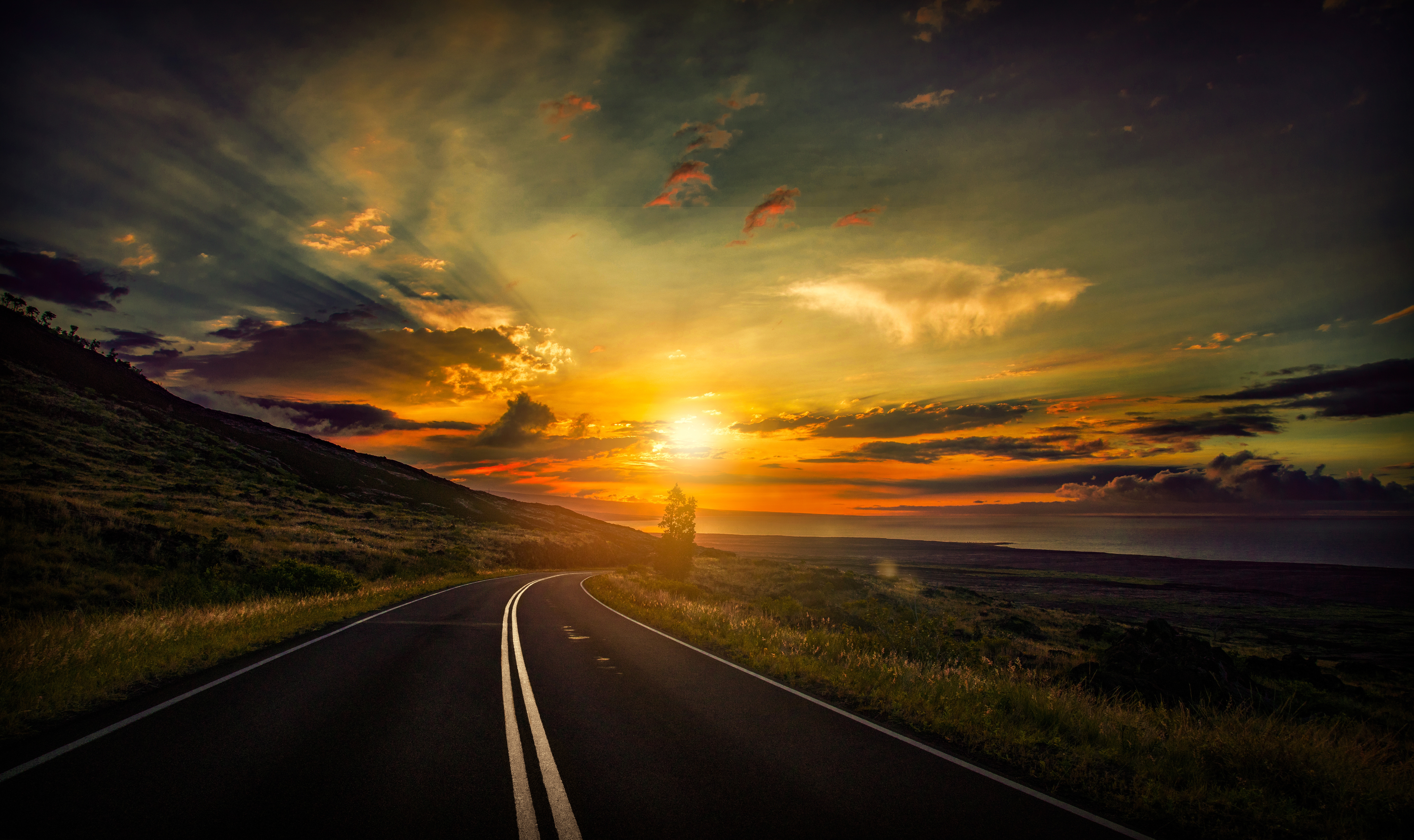 Road at sunset with dramatic sky HD Wallpaper