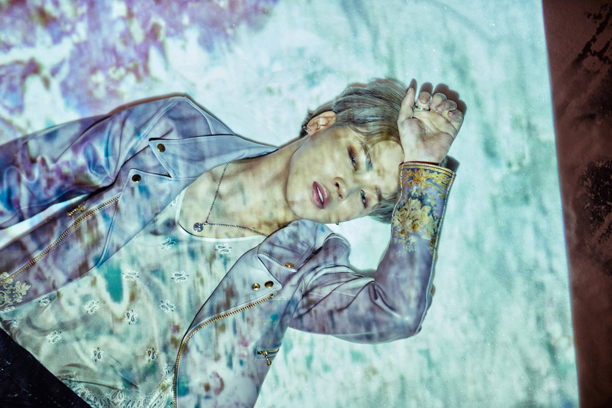 Jimin from BTS lying down with projected light HD Wallpaper