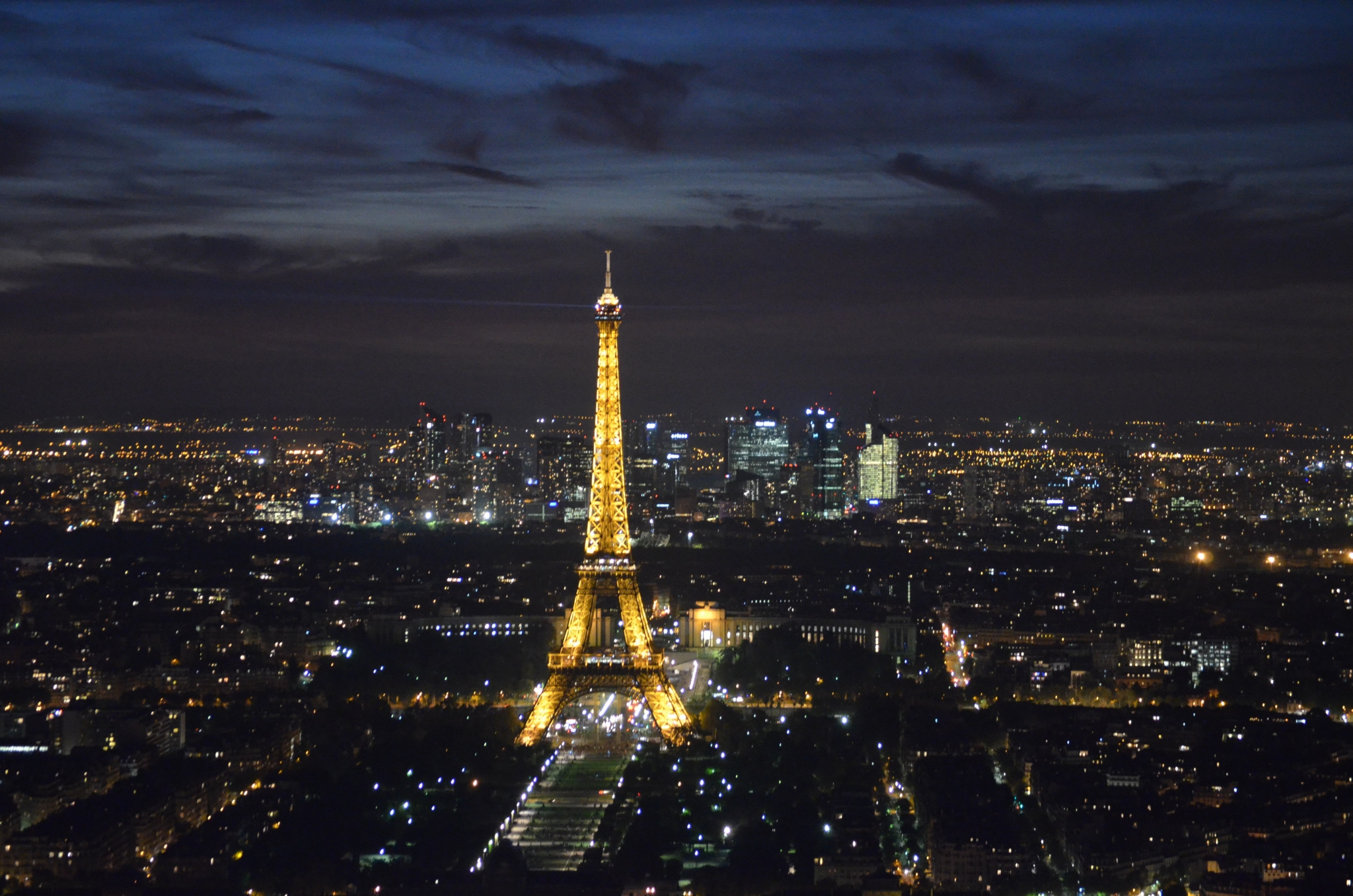 Eiffel Tower illuminated at night over Paris cityscape HD Wallpaper