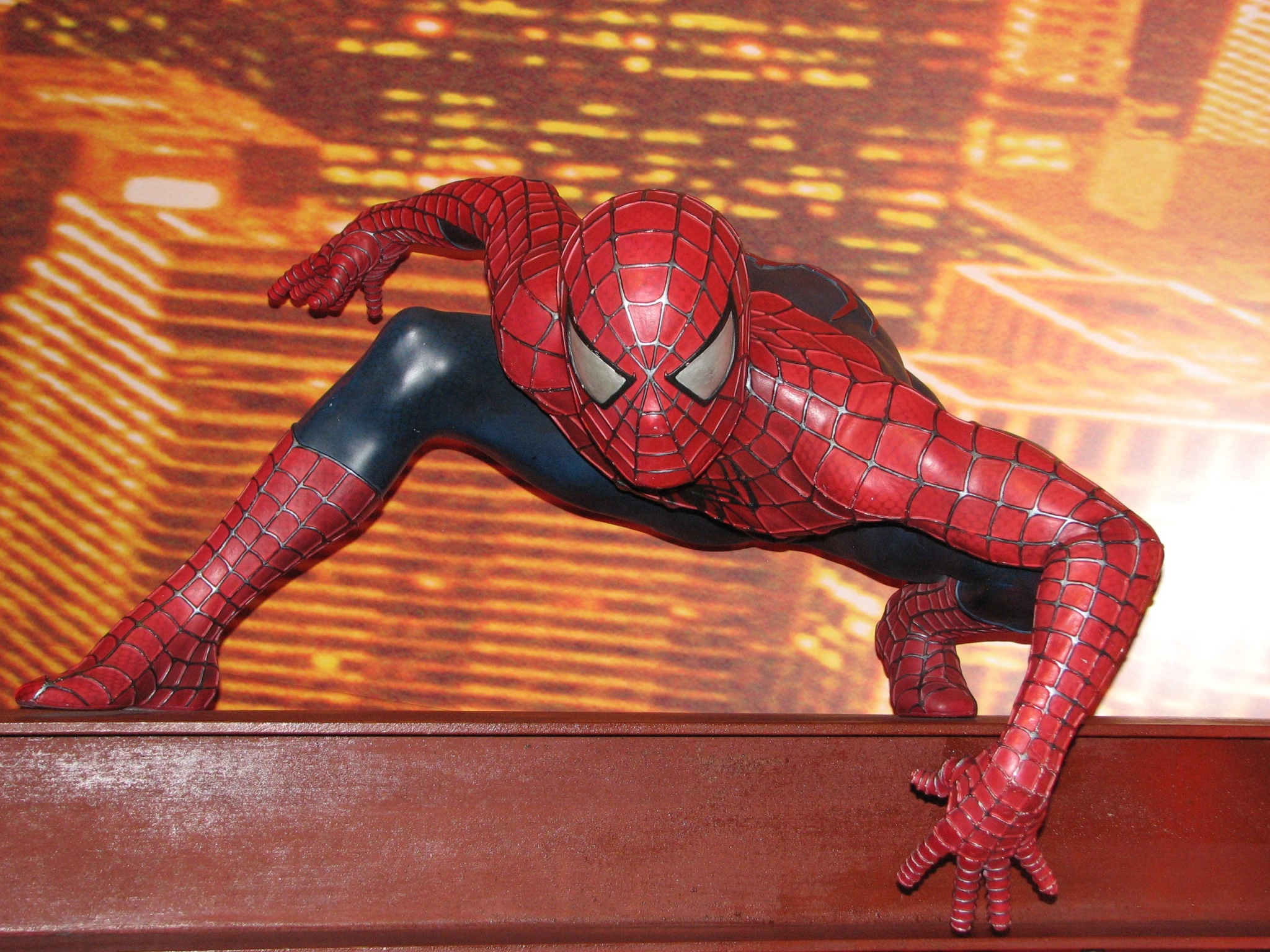 Spiderman statue on a beam HD Wallpaper