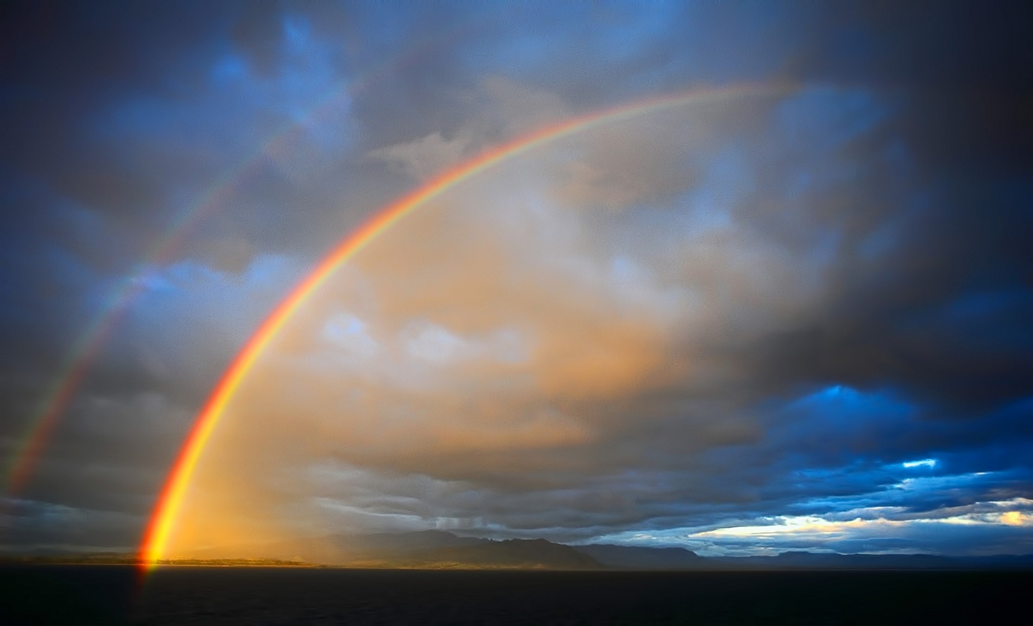 Double rainbow over the ocean and mountains HD Wallpaper