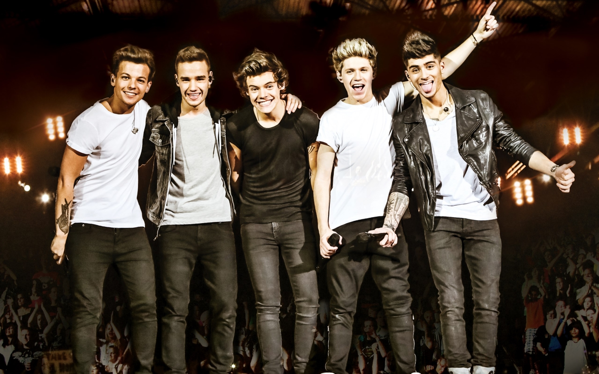 One Direction band members performing on stage HD Wallpaper