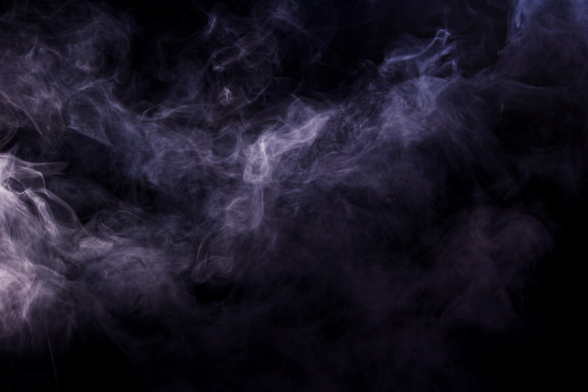 Purple smoke swirling against a black background HD Wallpaper