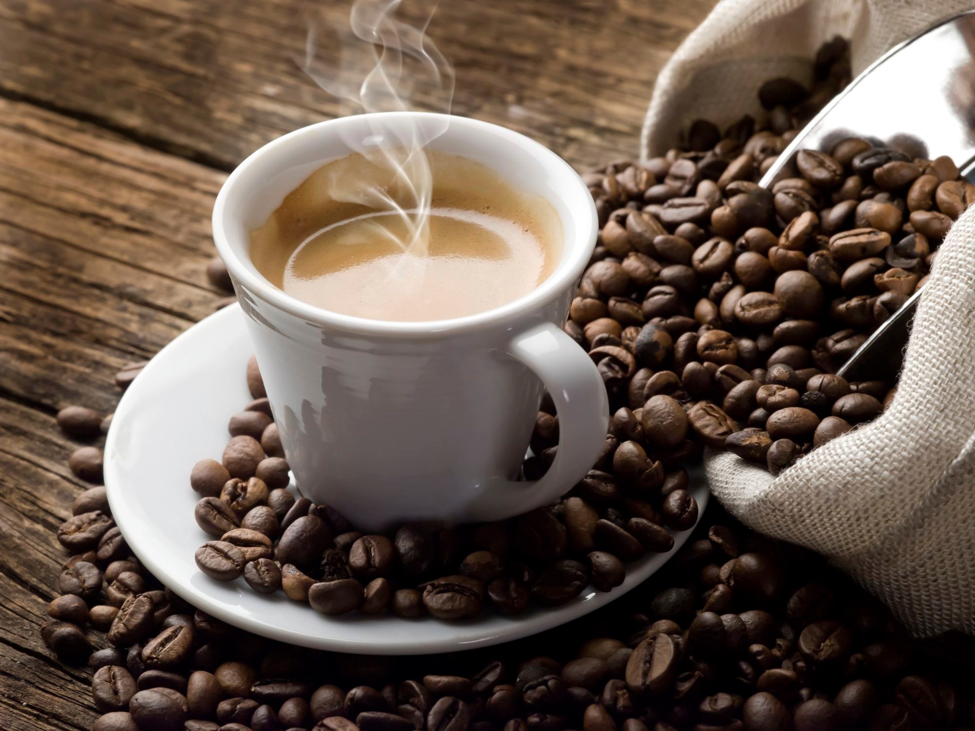 Espresso cup with coffee beans HD Wallpaper