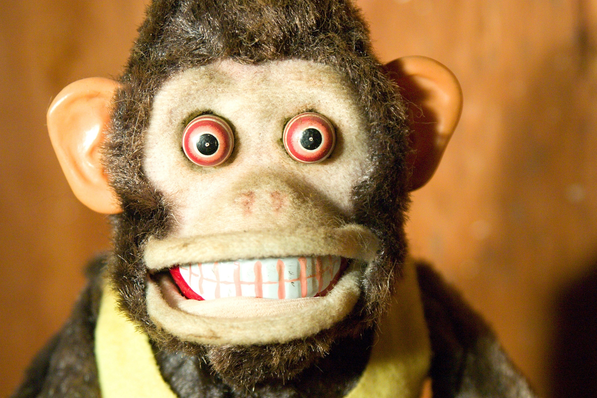 Close-up of a vintage mechanical monkey toy HD Wallpaper