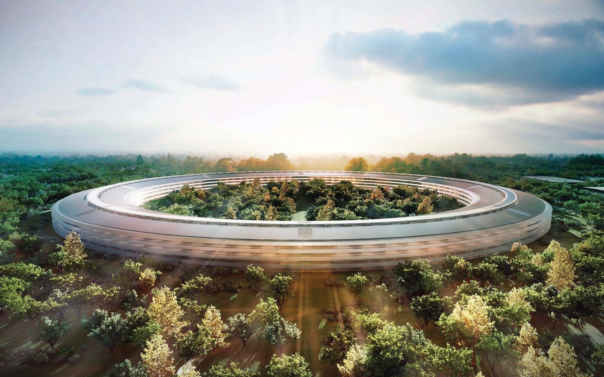 Apple Park building surrounded by trees HD Wallpaper