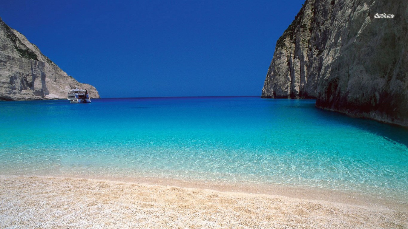 Beach with cliffs and boat HD Wallpaper