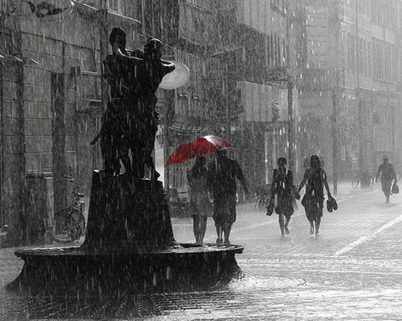 People walking in the rain with a red umbrella HD Wallpaper