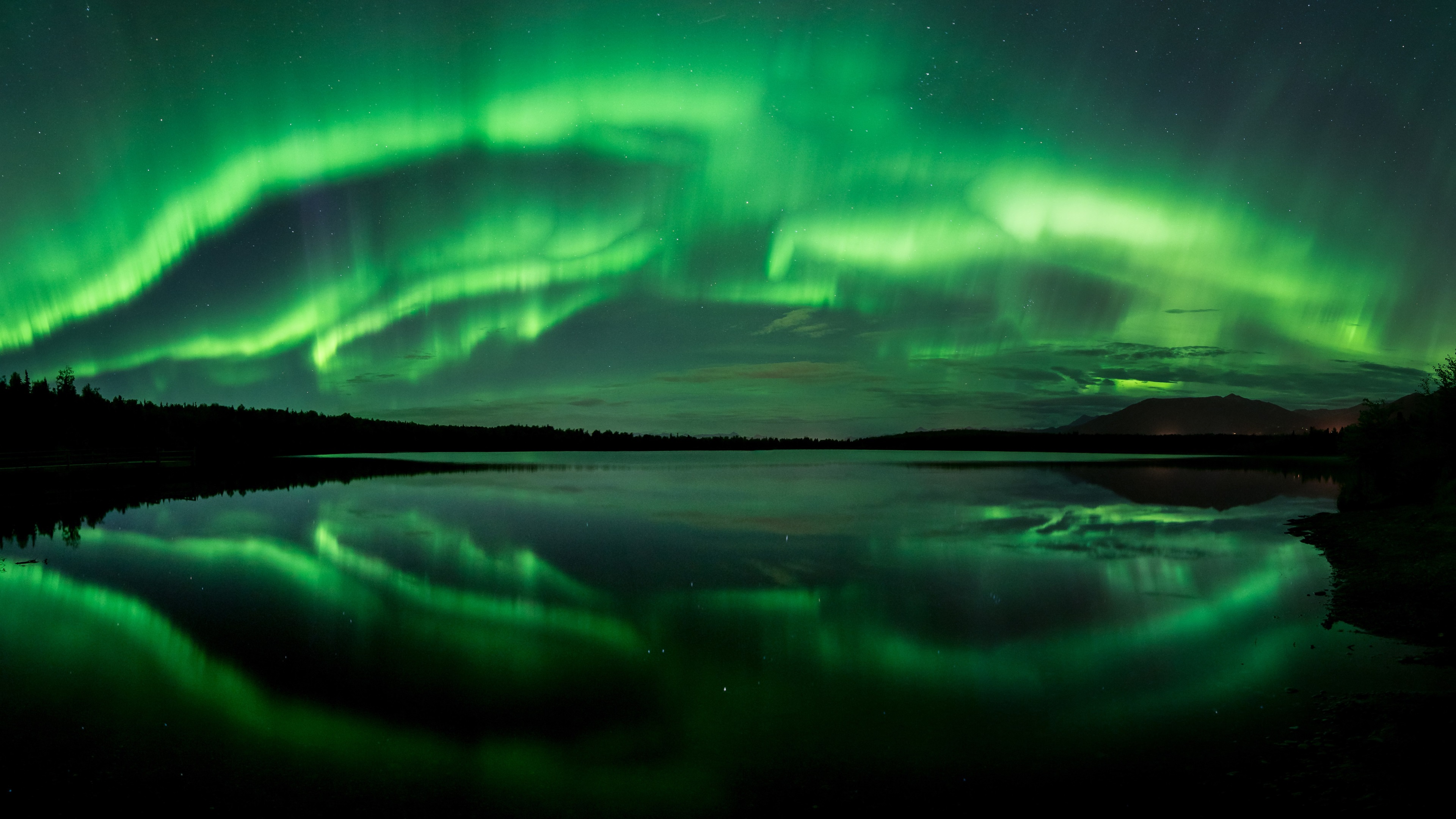 Aurora Borealis over a lake 4K HD Wallpaper
