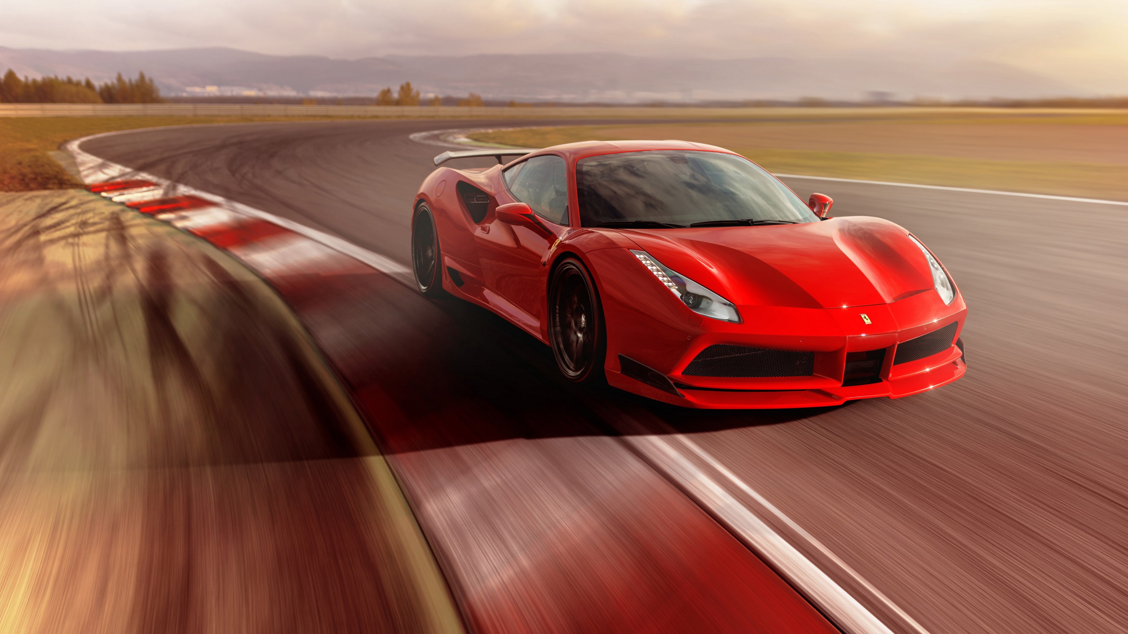 Red Ferrari 488 GTB on a race track 4K HD Wallpaper