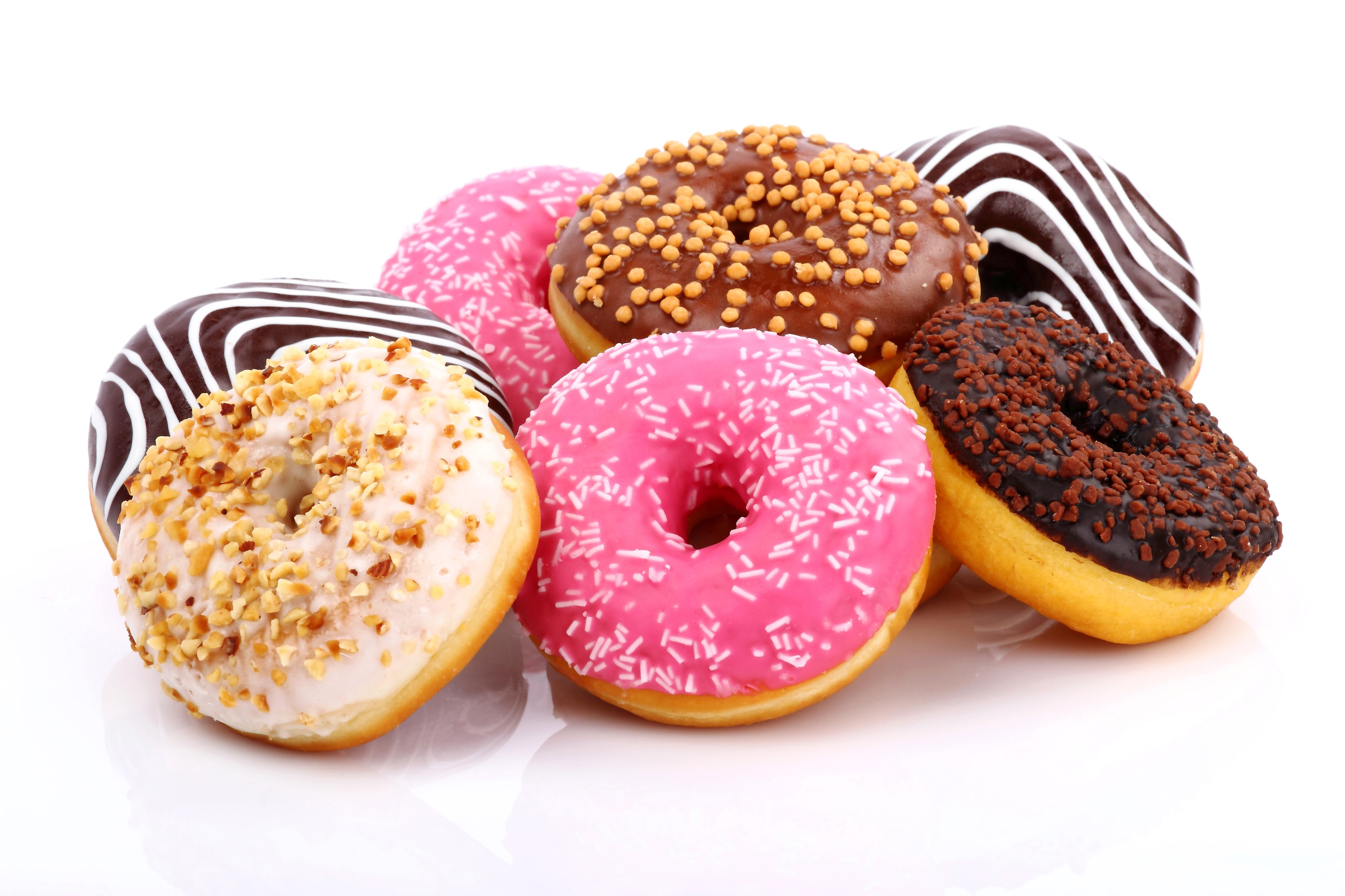 Assortment of colorful donuts with toppings HD Wallpaper