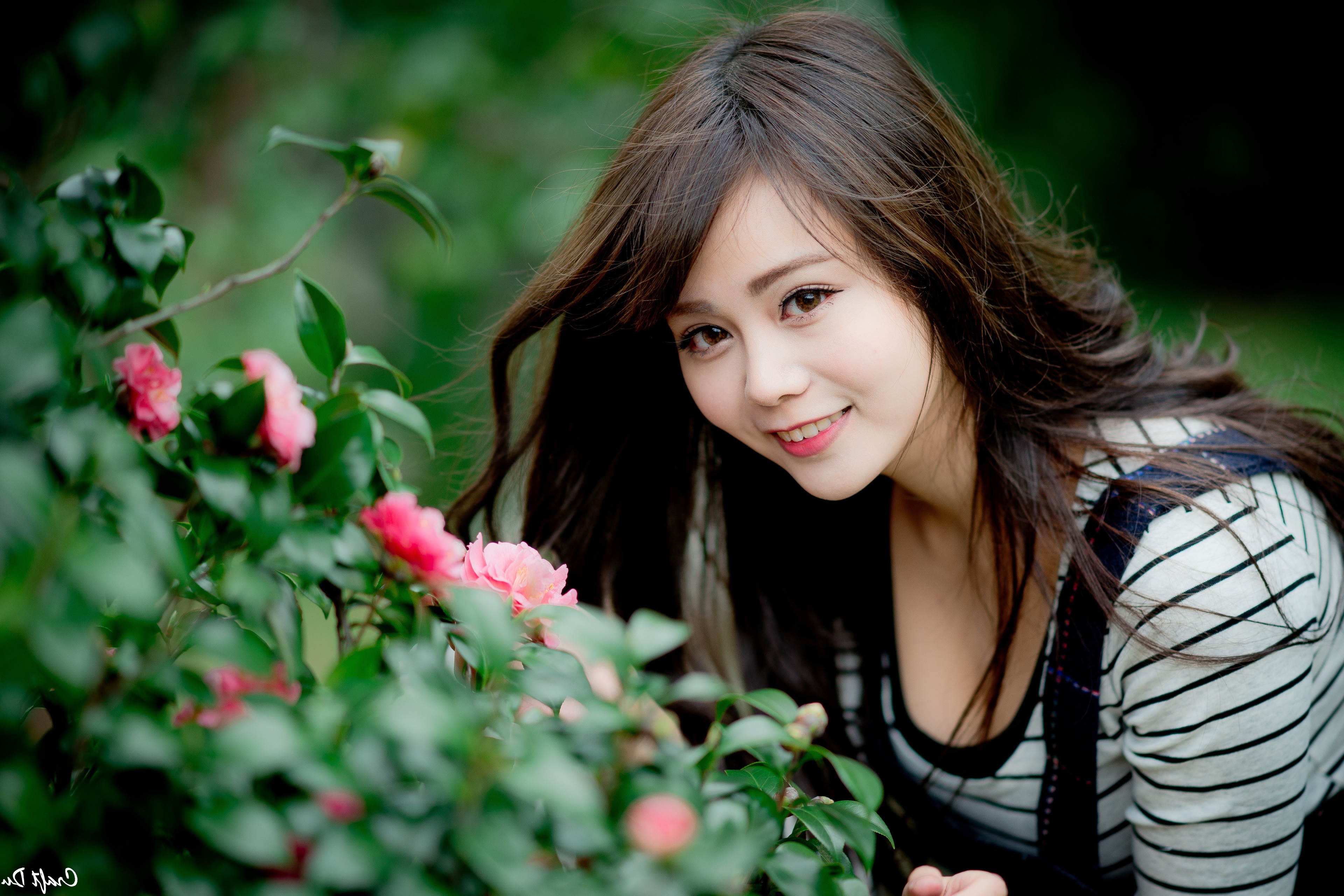 Smiling Asian Woman with Flowers 4K HD Wallpaper