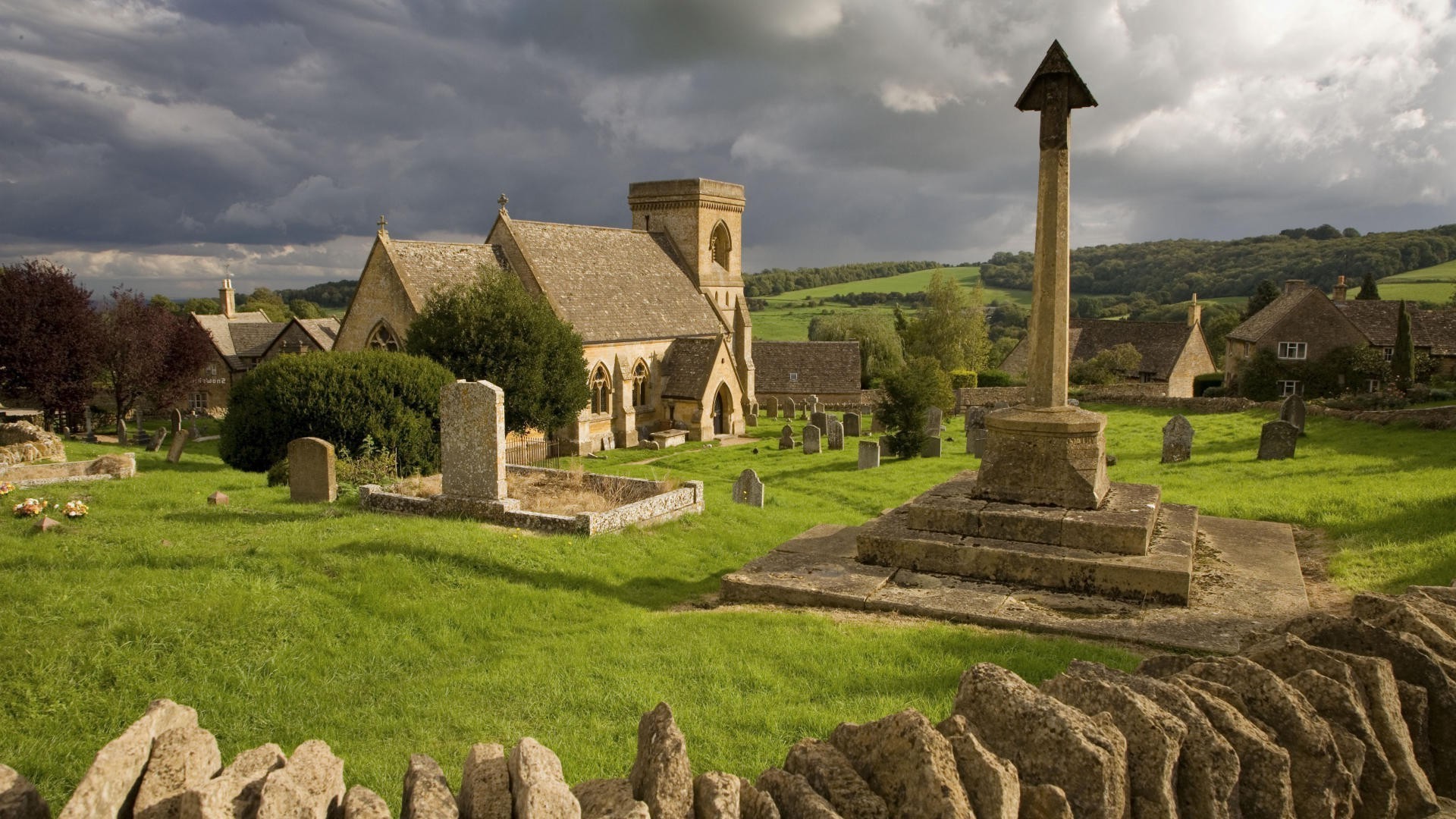 Church and graveyard with stone cross in England HD Wallpaper