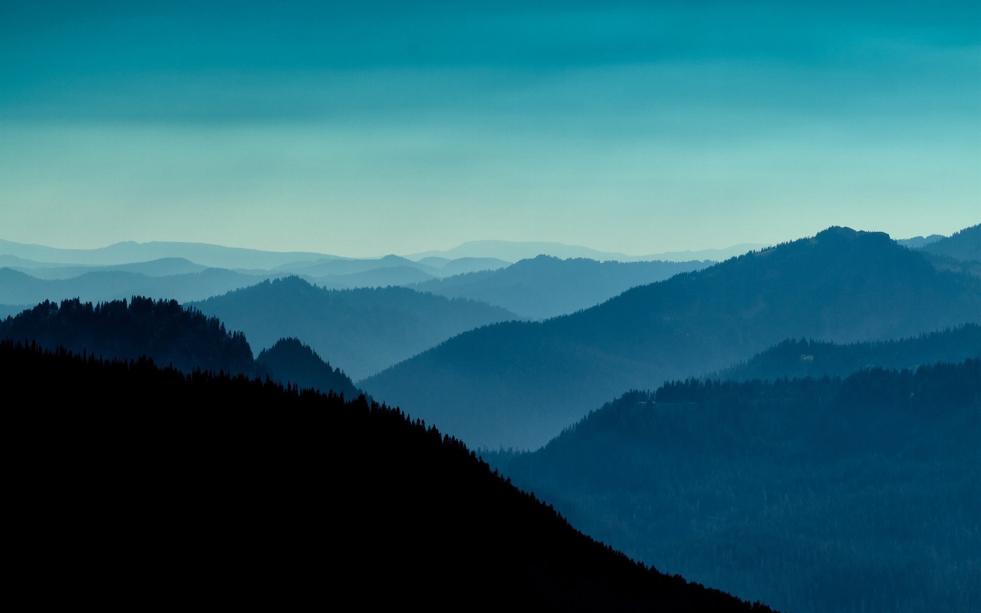 Blue mountain ranges at dusk with a clear sky HD Wallpaper
