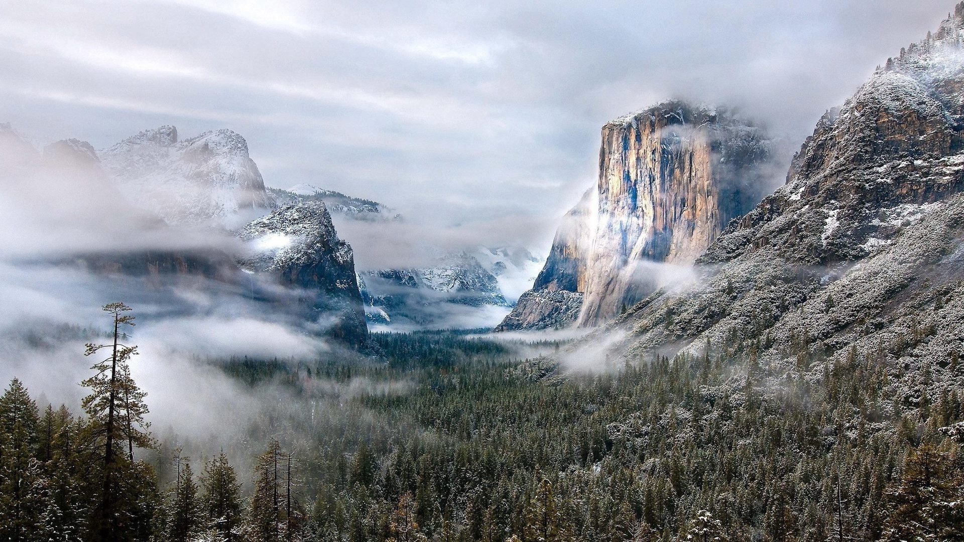 Snowy Yosemite Valley with El Capitan and Clouds HD Wallpaper