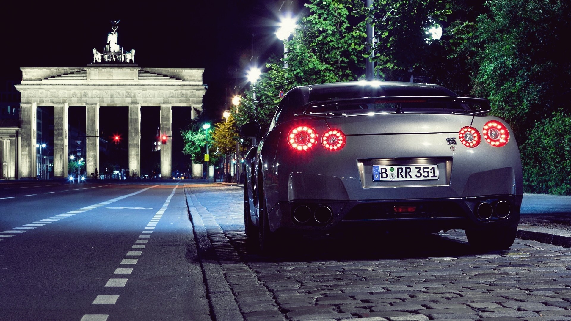 Nissan GT-R R35 parked at Brandenburg Gate at night HD Wallpaper