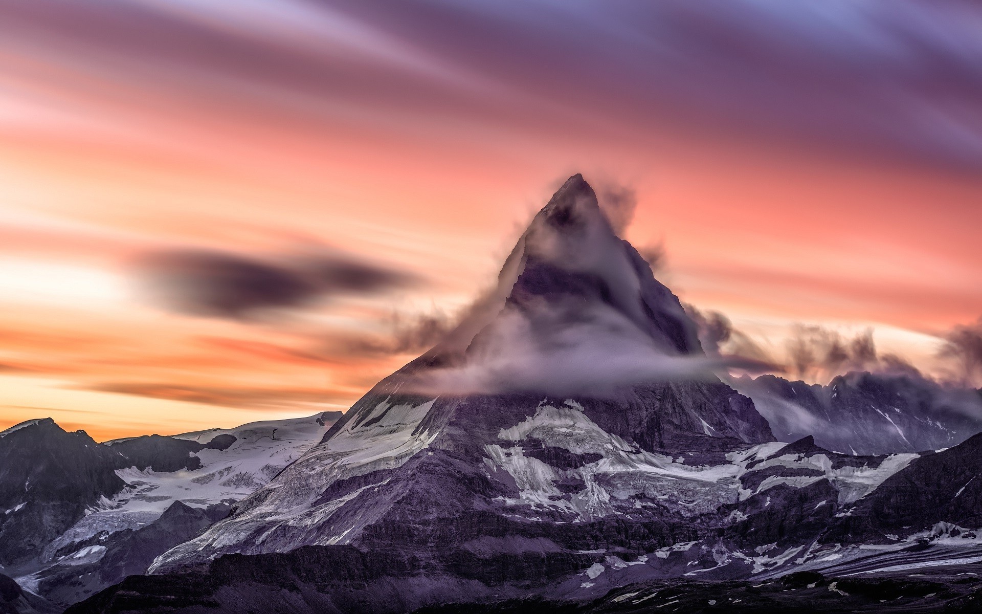 Matterhorn mountain at sunset with clouds and long exposure HD Wallpaper