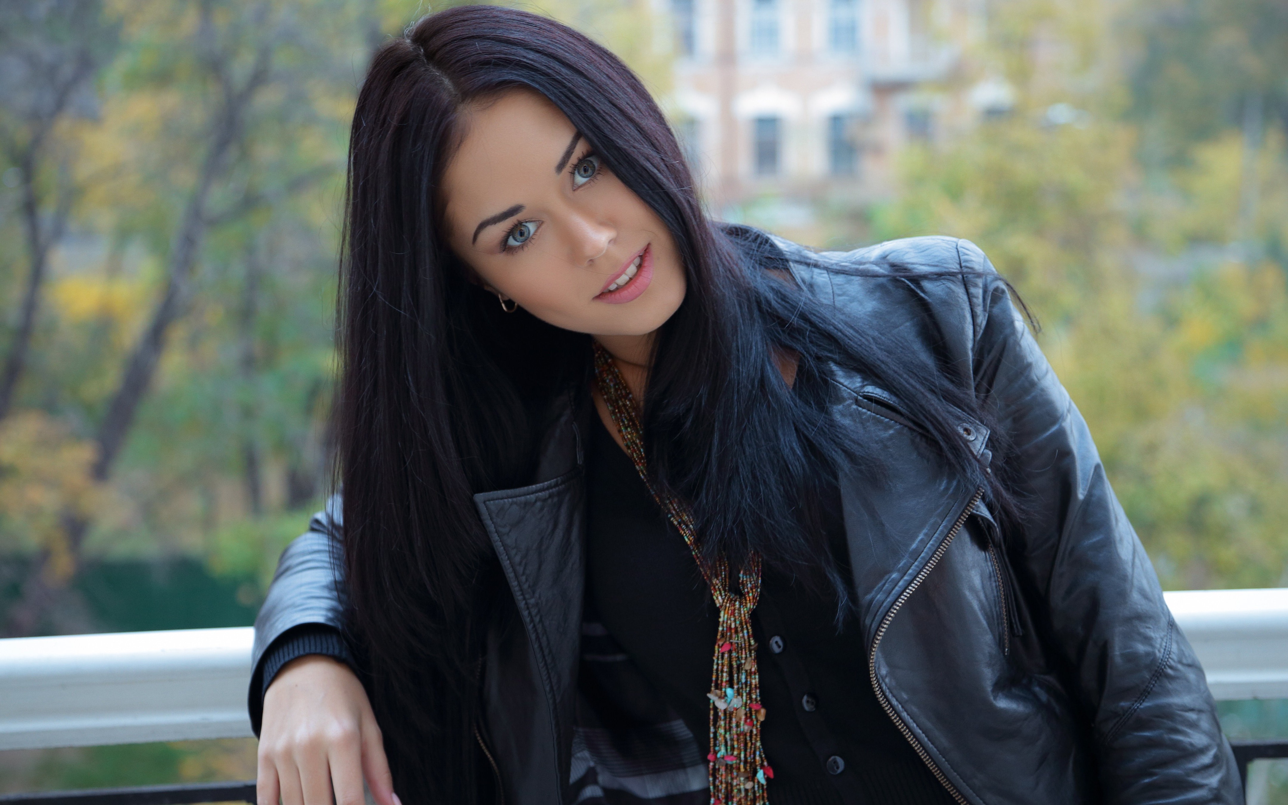 Woman with black hair on a balcony HD Wallpaper