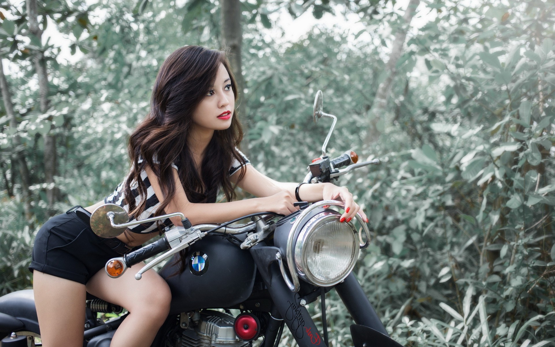 Woman on a BMW motorcycle in nature HD Wallpaper