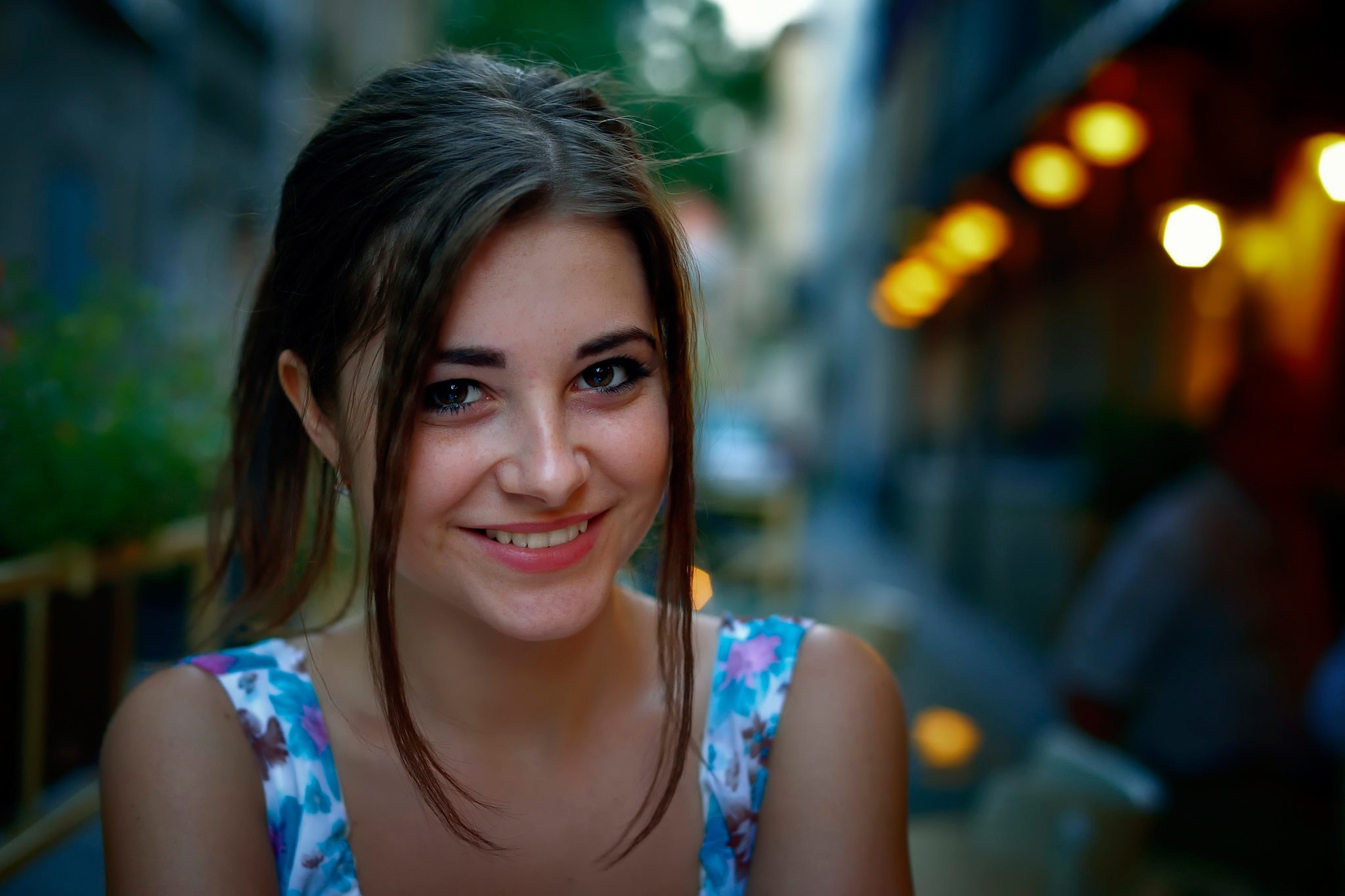 Woman with dark eyes and brown hair smiling HD Wallpaper