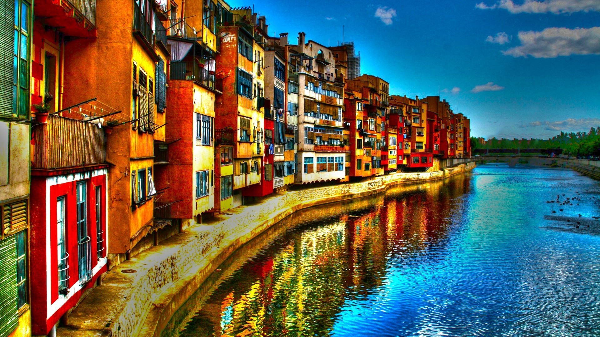 Colorful buildings along a river in Girona, Spain HD Wallpaper