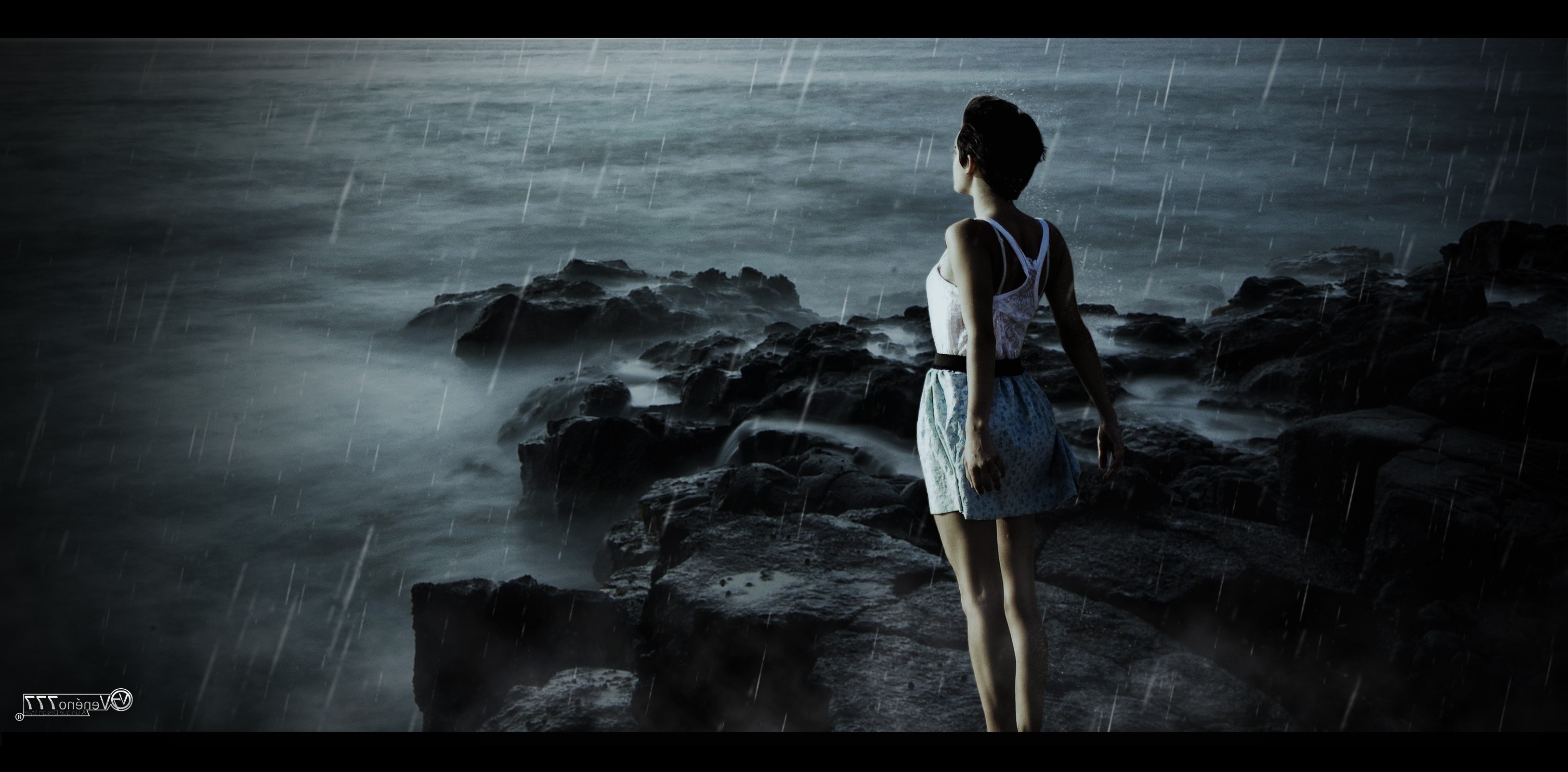 Woman standing on rocks in the rain by the sea HD Wallpaper
