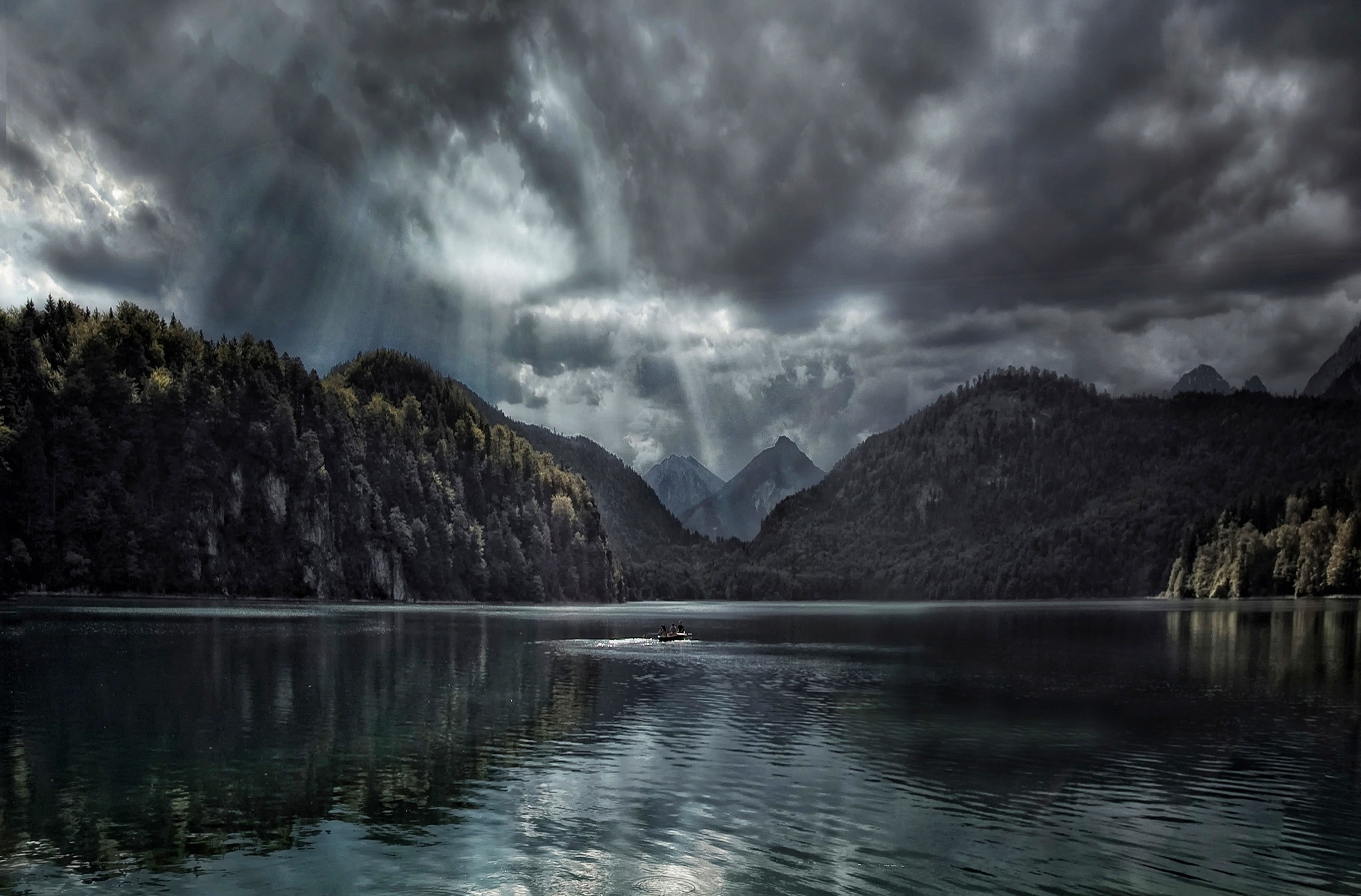 Boat on a lake with mountains and sun rays HD Wallpaper