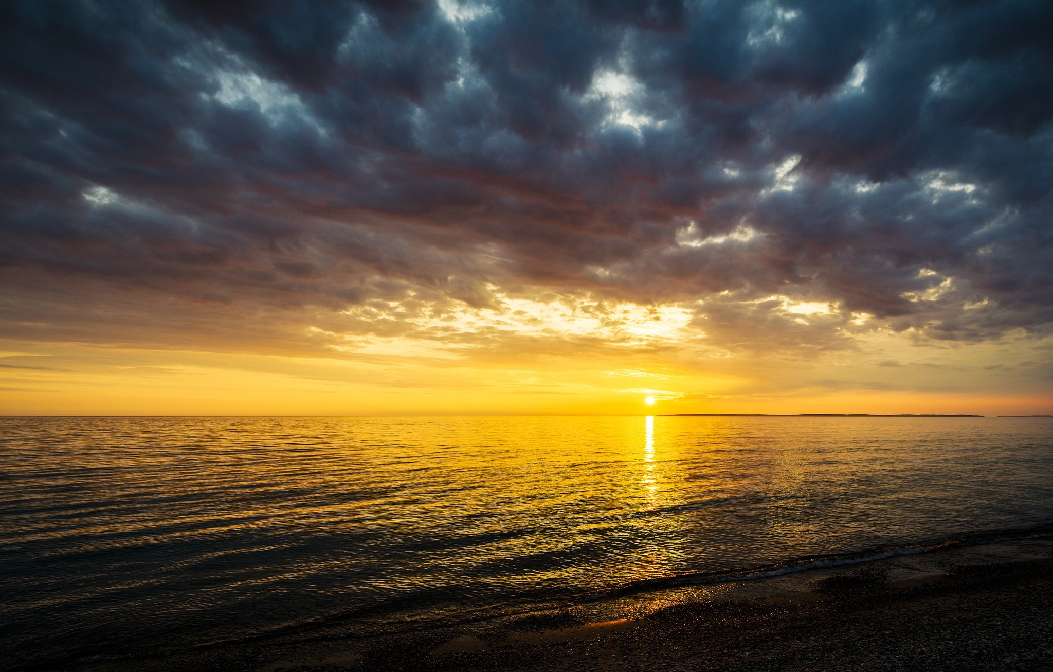 Sunset over the sea with dramatic clouds HD Wallpaper