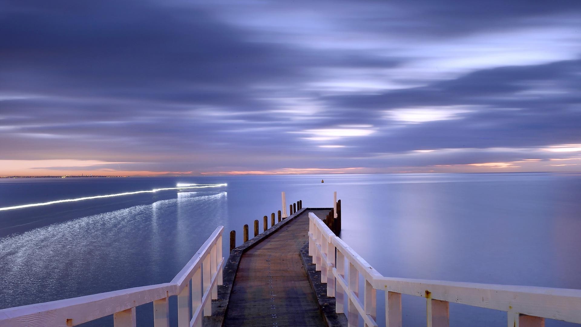 Sunset over the ocean with a pier HD Wallpaper