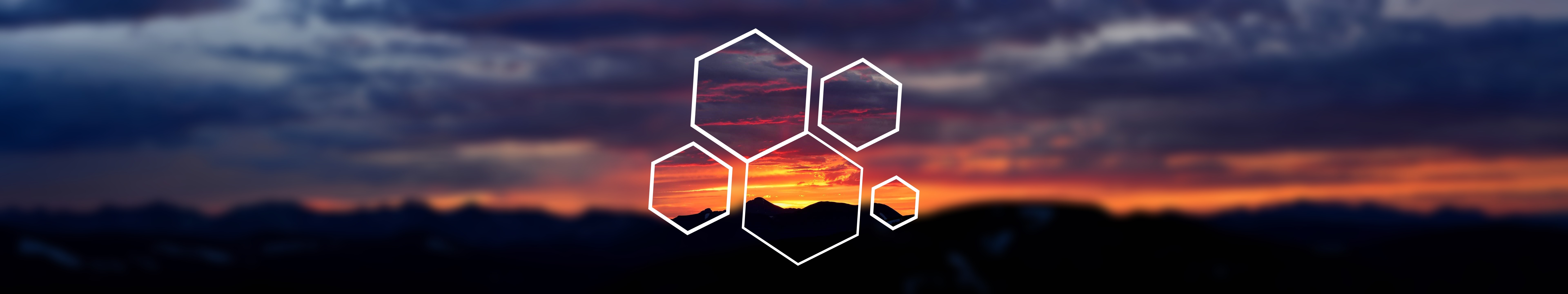 Hexagons overlaying a blurred sunset landscape HD Wallpaper