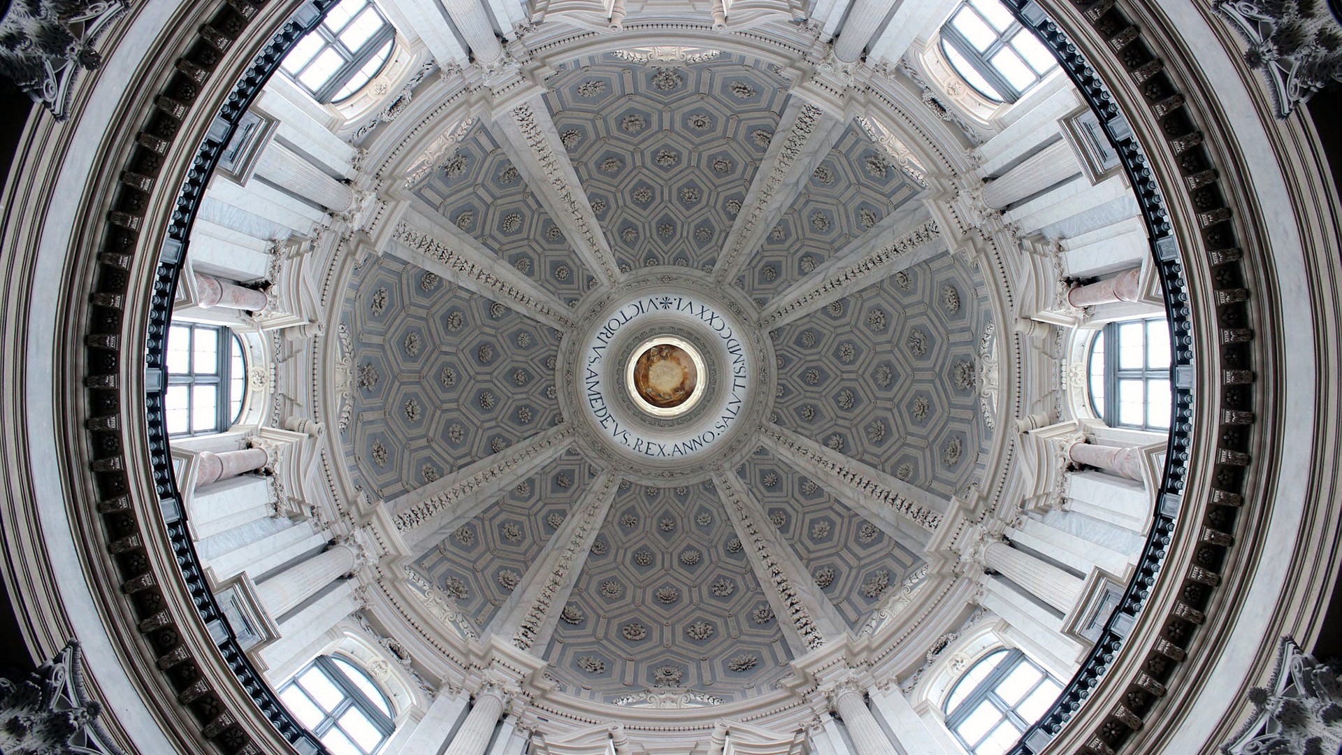 Interior of a grand dome with ornate carvings and windows HD Wallpaper