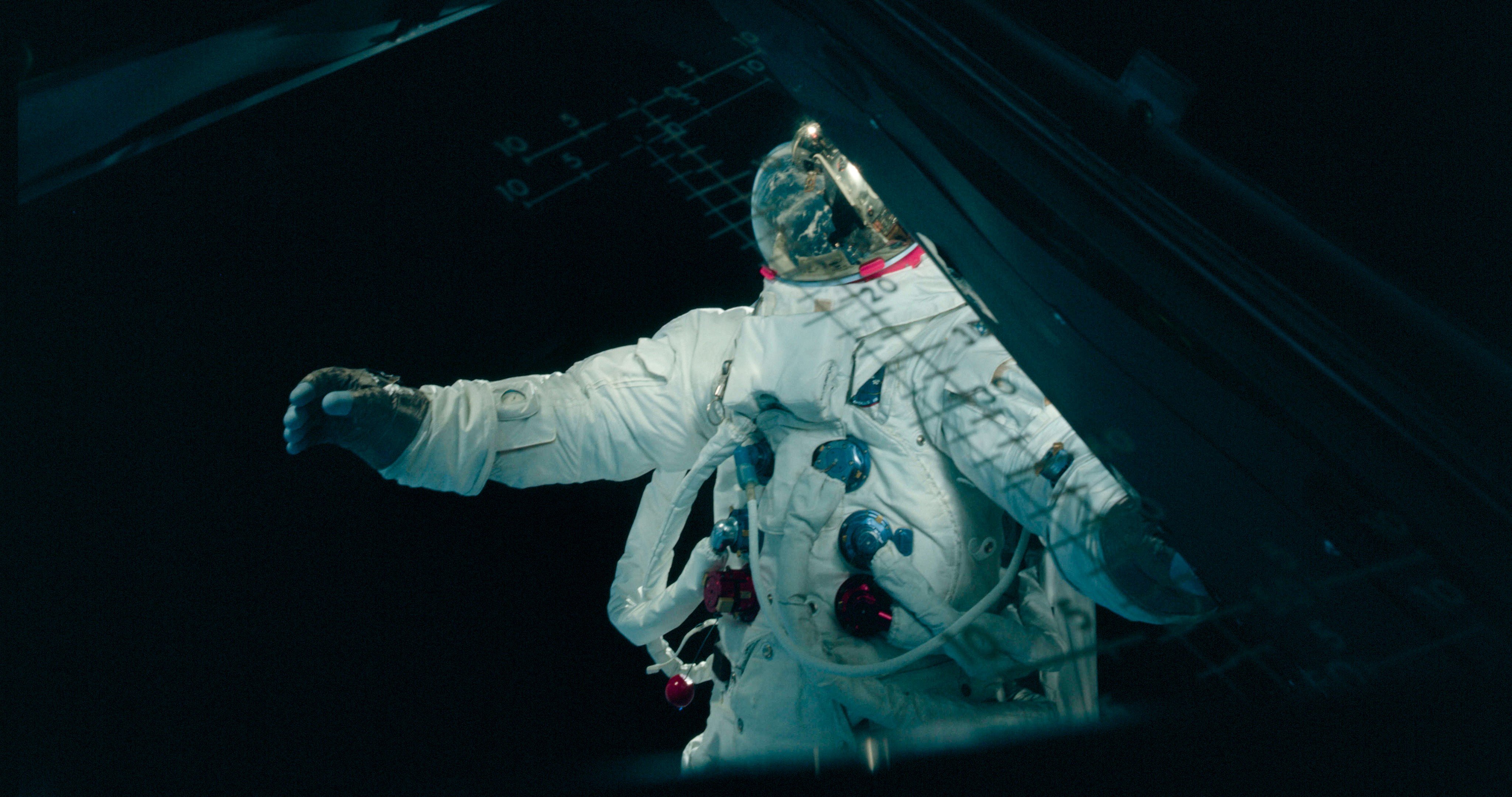 Apollo astronaut in a spacecraft HD Wallpaper