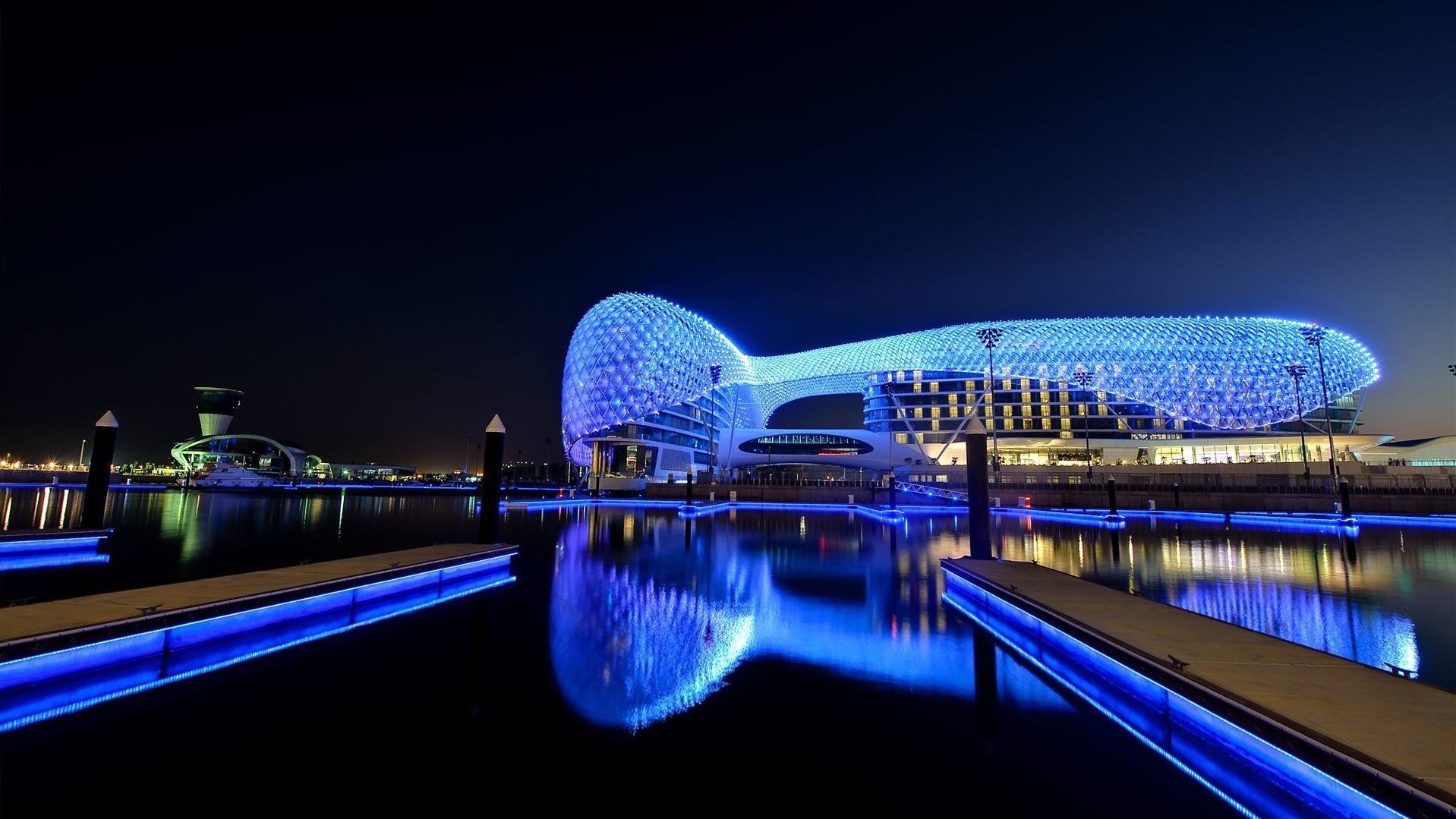 Yas Marina Circuit Abu Dhabi at night with blue lights HD Wallpaper