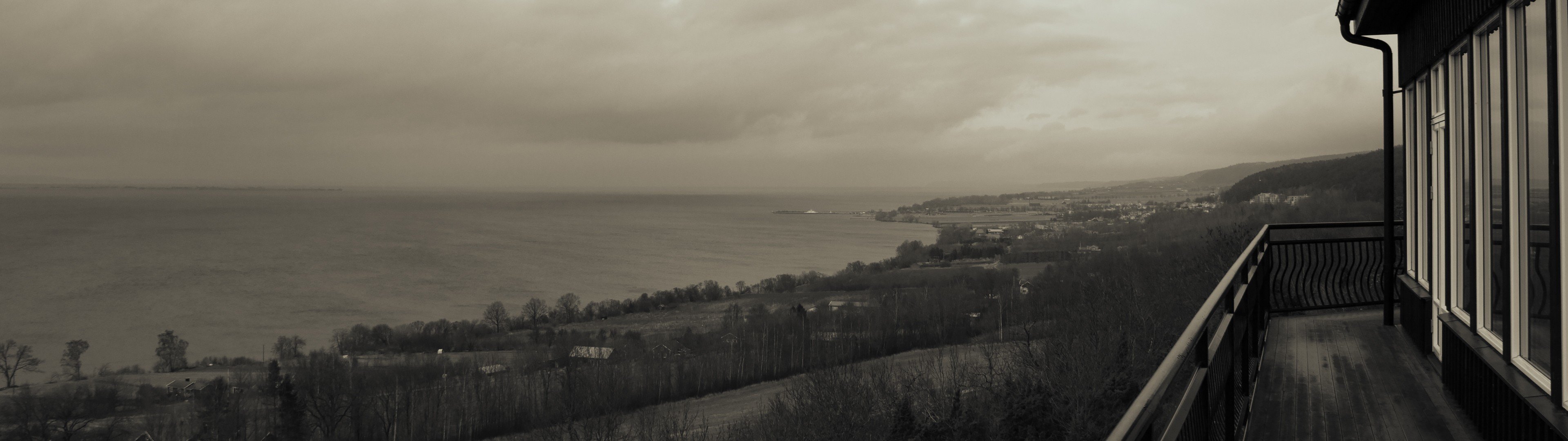 Panoramic view of a coastline from a balcony HD Wallpaper
