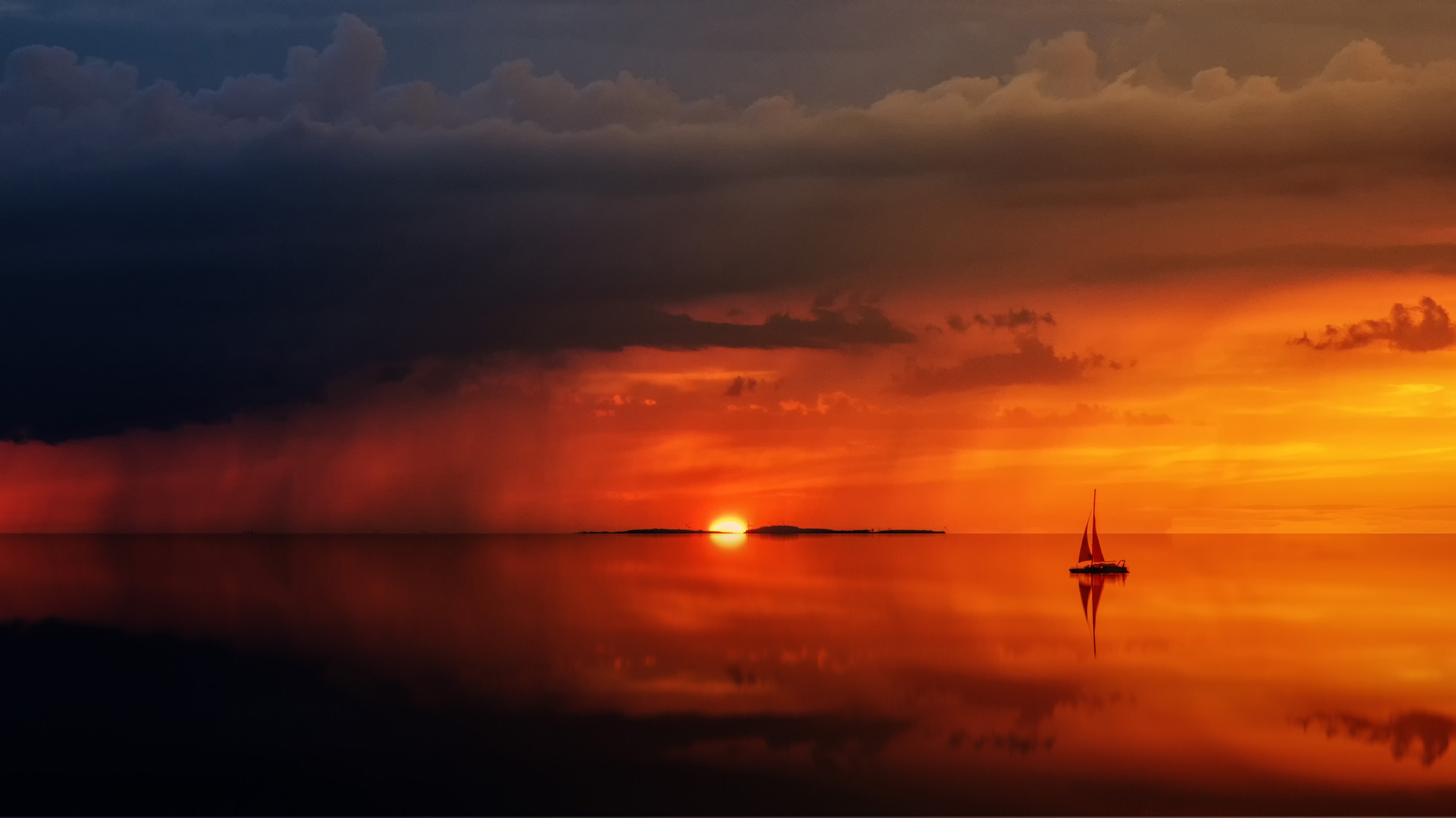 Sailboat on the sea during a dramatic sunset HD Wallpaper