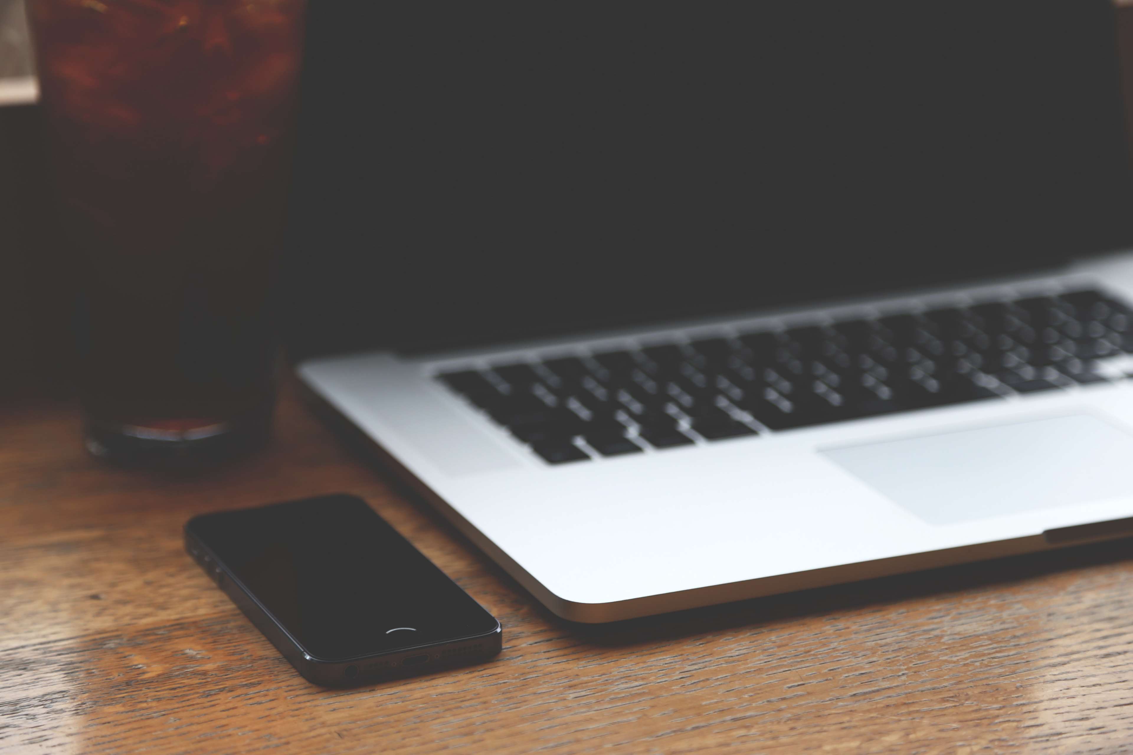 Smartphone and Laptop on Wooden Table HD Wallpaper