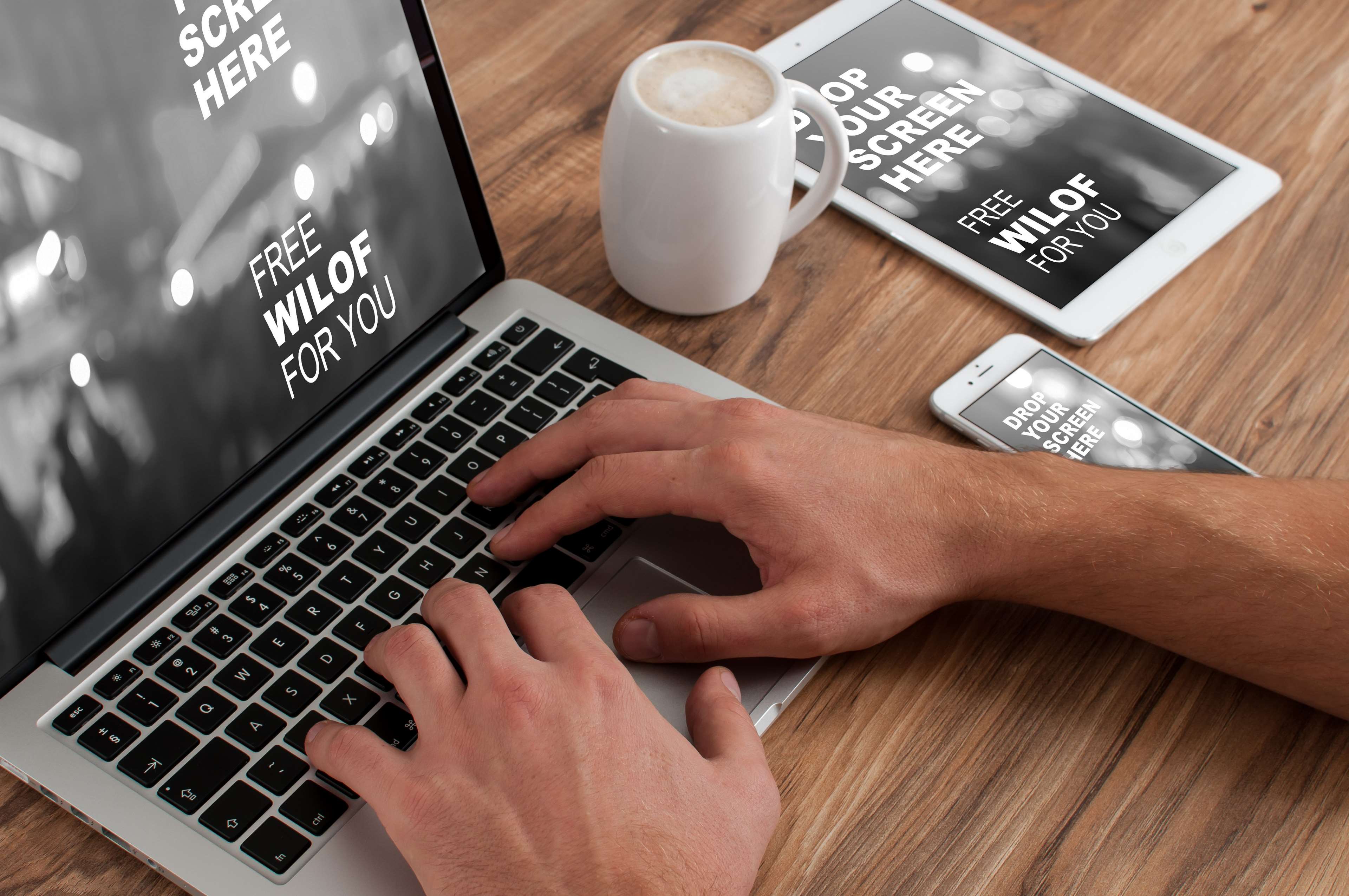 Hands typing on MacBook with iPad and iPhone HD Wallpaper