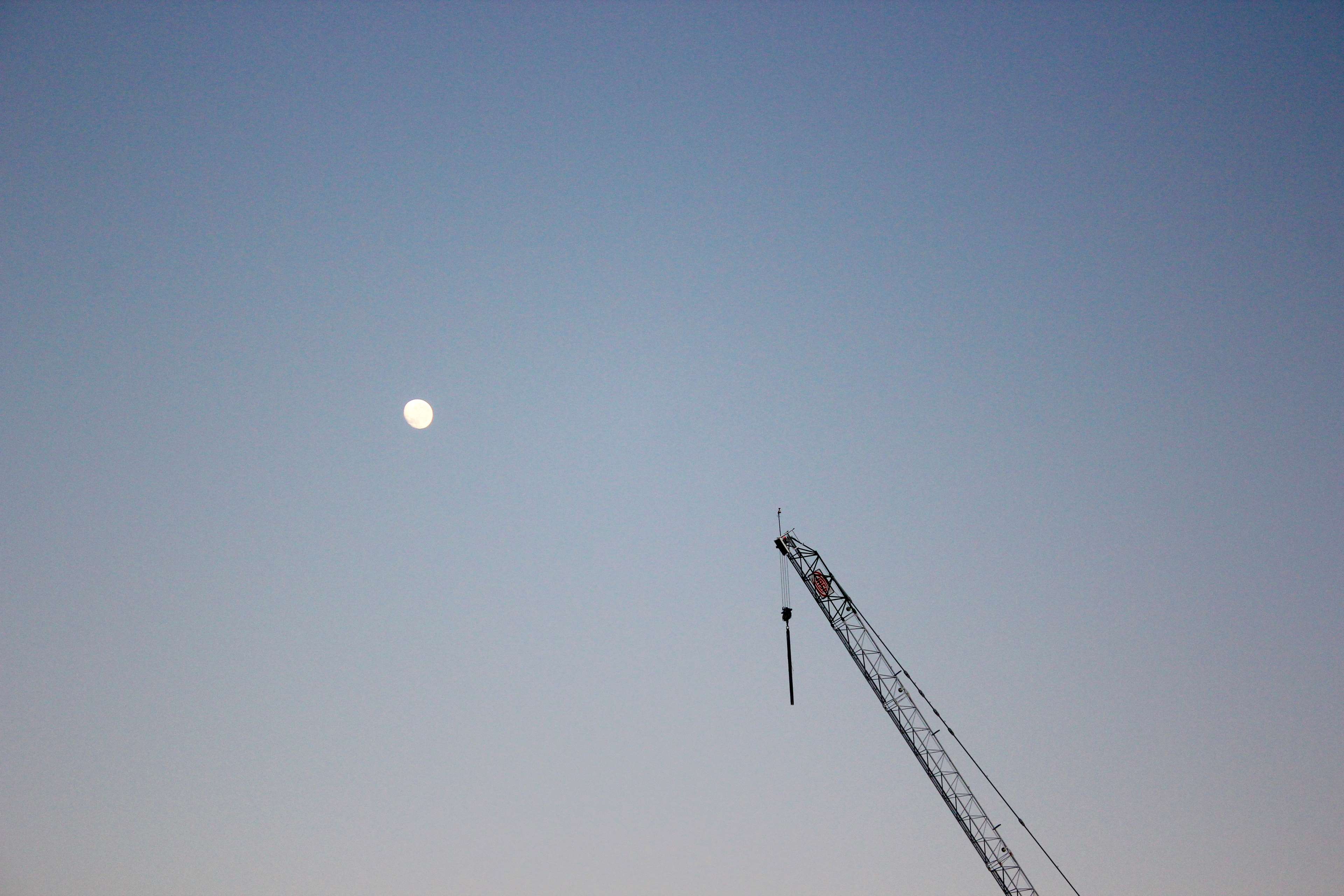 Minimalist crane and full moon in clear sky HD Wallpaper