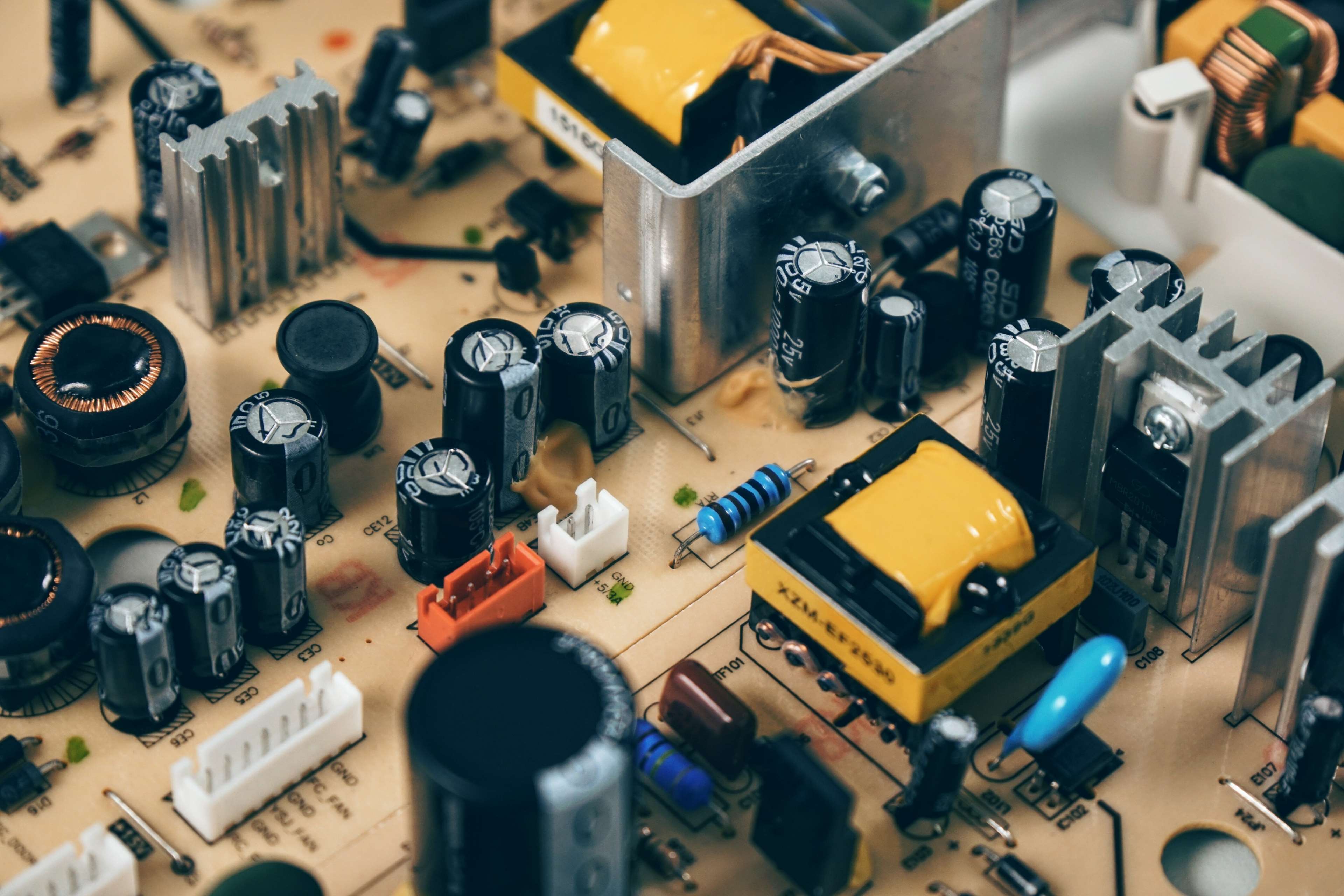 Close up of electronic circuit board components HD Wallpaper